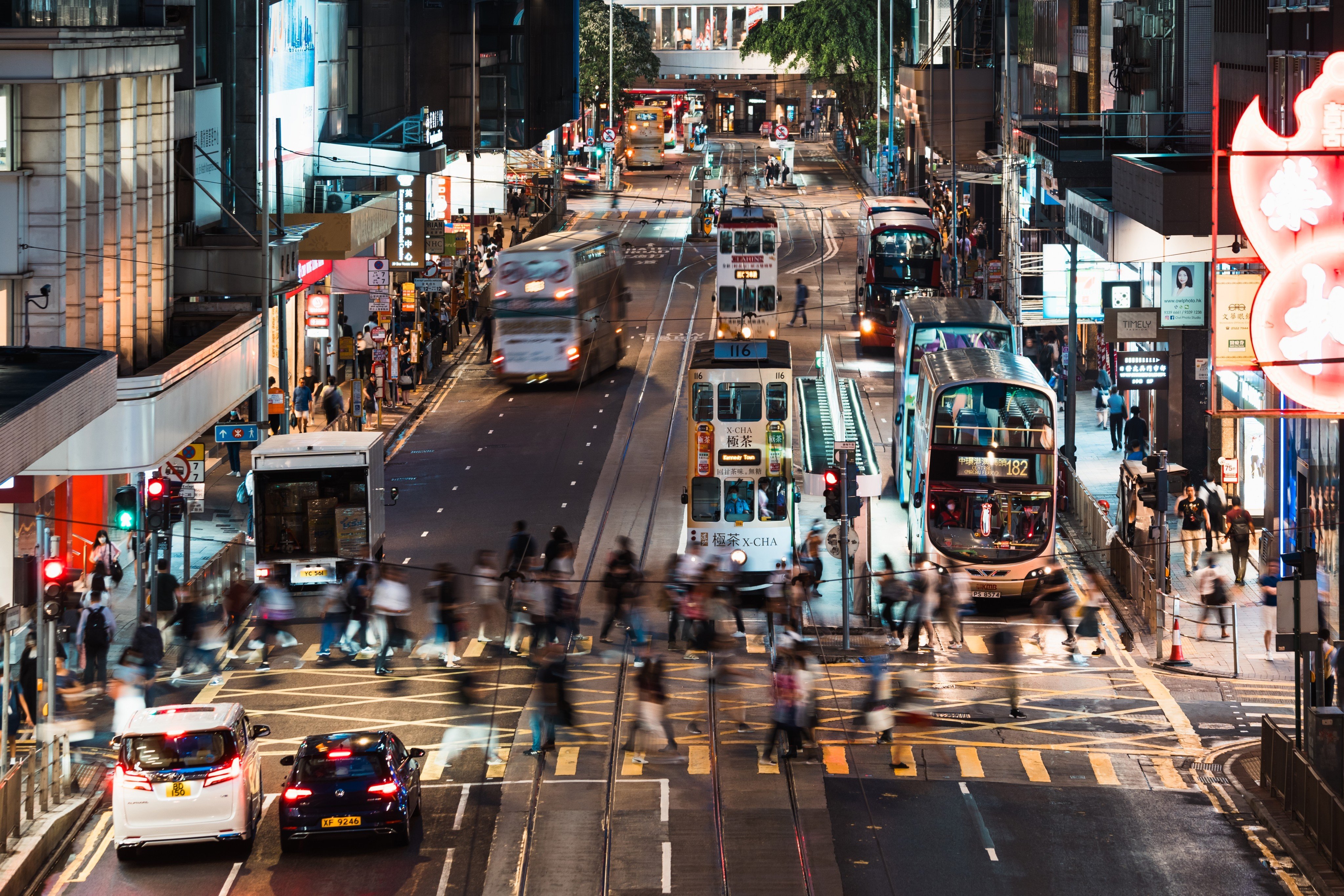 Pedestrians cross a road in Central in June 2023. Running Hong Kong through trickle-down mainland pronouncements  - however well-meaning – runs the risk of pushing the city further into the shadows. Photo: Shutterstock

