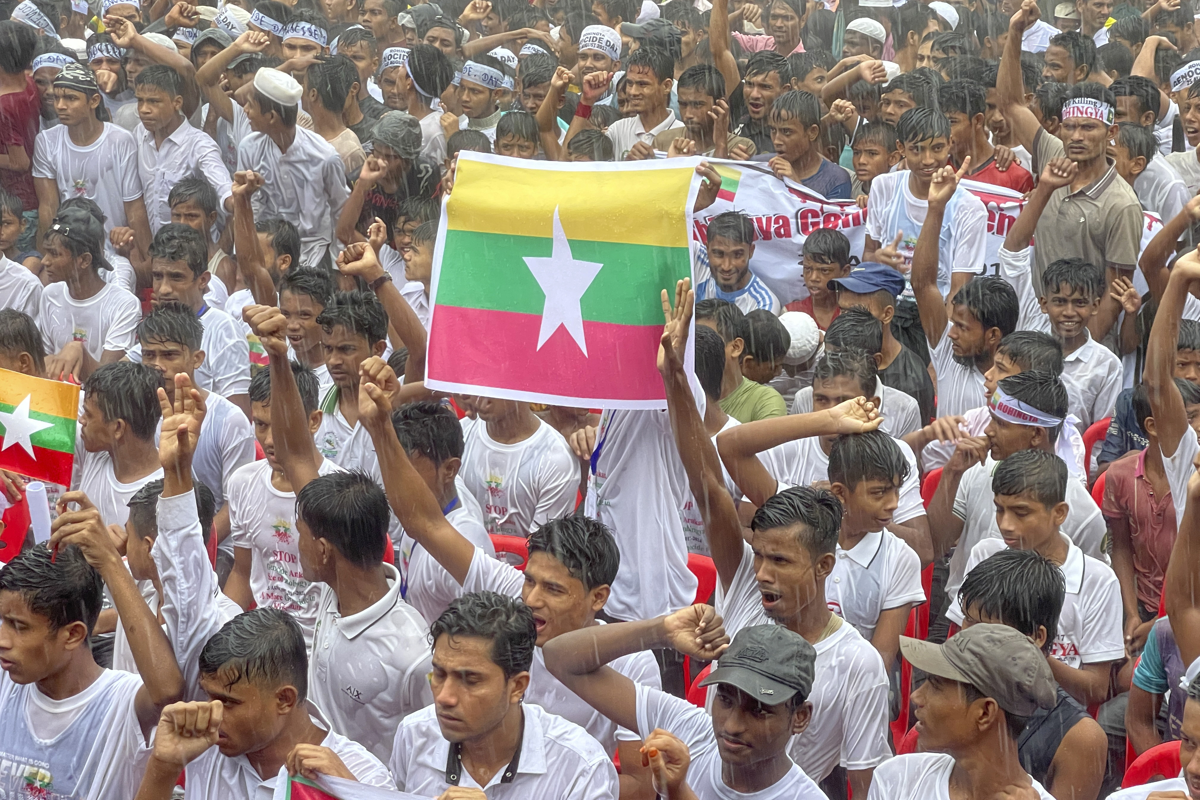 Rohingya refugees gather in the rain to demand safe return to Myanmar’s Rakhine state as they mark the seventh anniversary of their mass exodus at their refugee camp in Cox’s Bazar, Bangladesh on August 25. Photo: AP