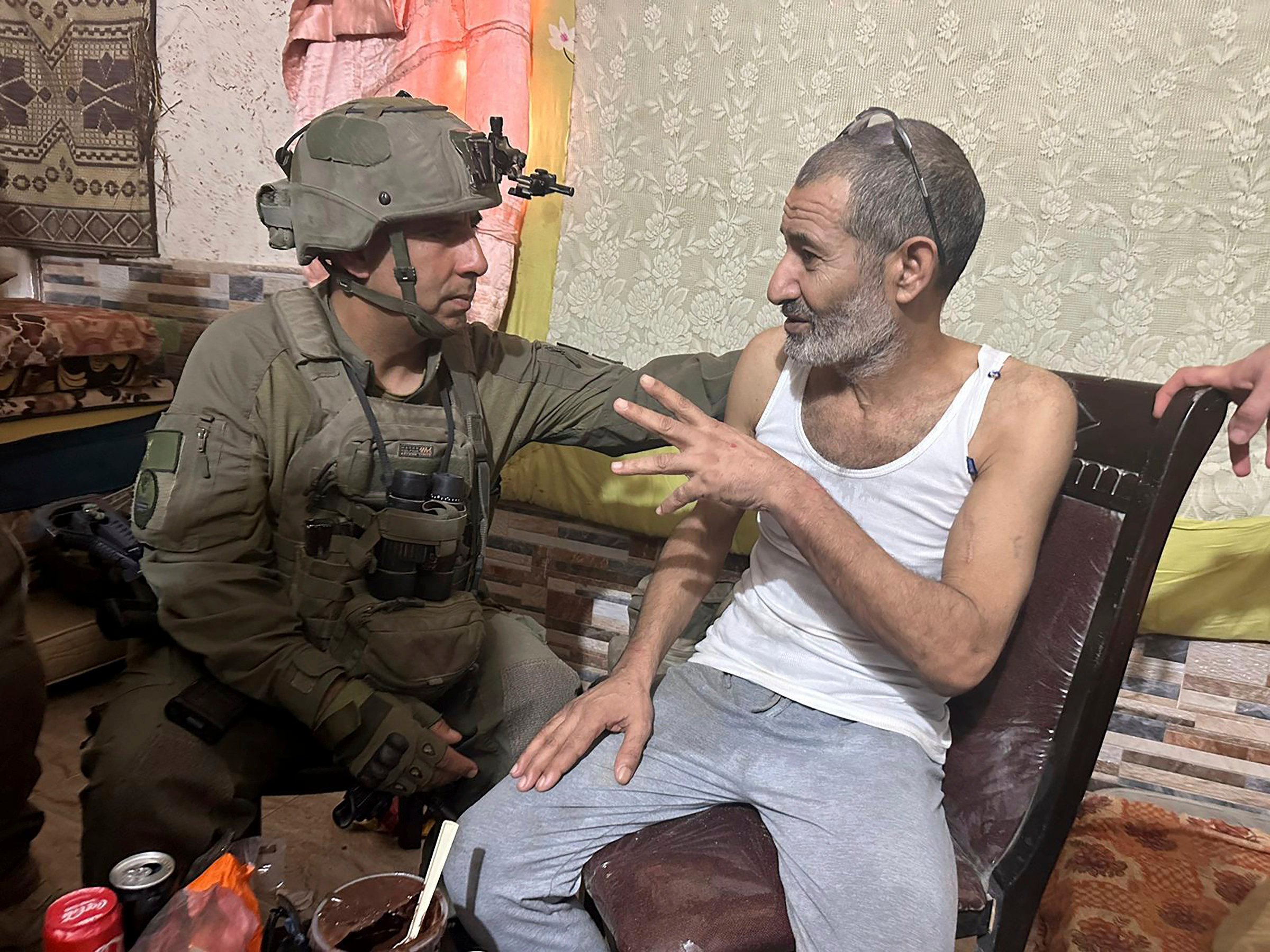 Qaid Farhan Alkadi, right, and Brigadier General Itzik Cohen talk after his rescue. Photo: Israeli Defence Forces via AP