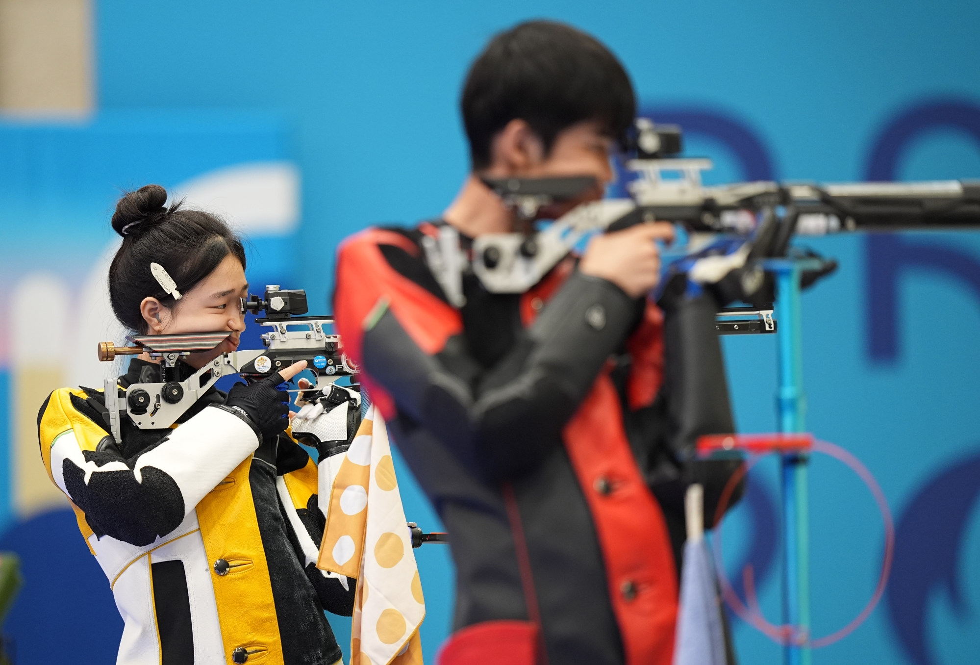 Huang Yuting (left) and Sheng Lihao went viral for their brightly coloured “cyberpunk” outfits. Photo: Xinhua