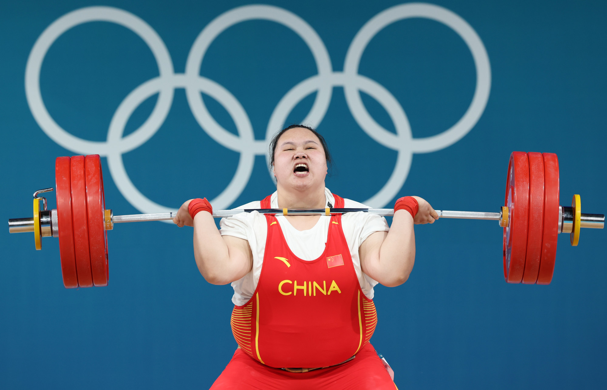 Li Wenwen made her Games debut in Tokyo three years ago, bringing home a gold and breaking three Olympic records. Photo: Xinhua