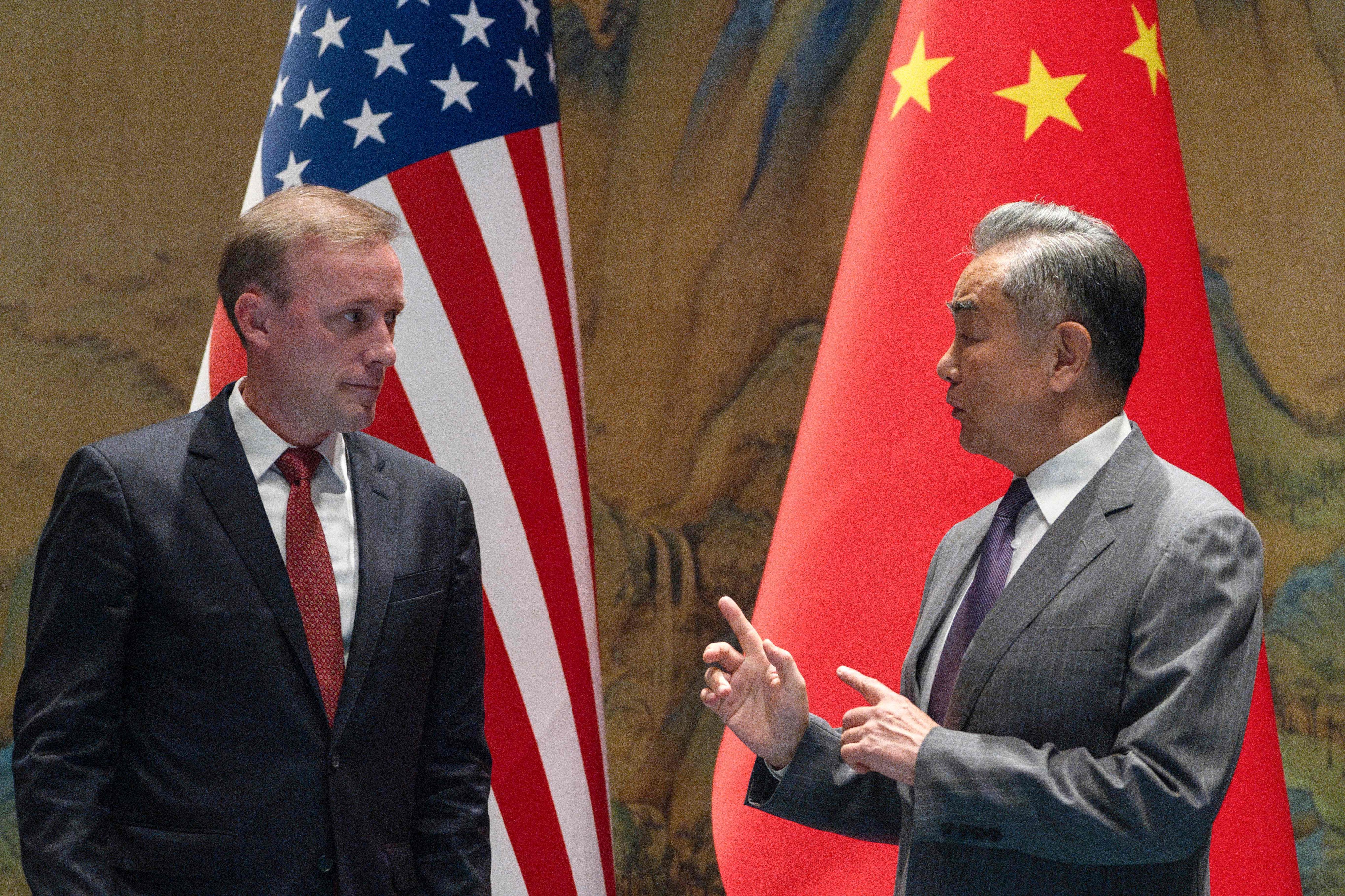 China’s Foreign Minister Wang Yi gestures near US National Security Advisor Jake Sullivan before talks at Yanqi Lake in Beijing on Tuesday. Photo: AFP