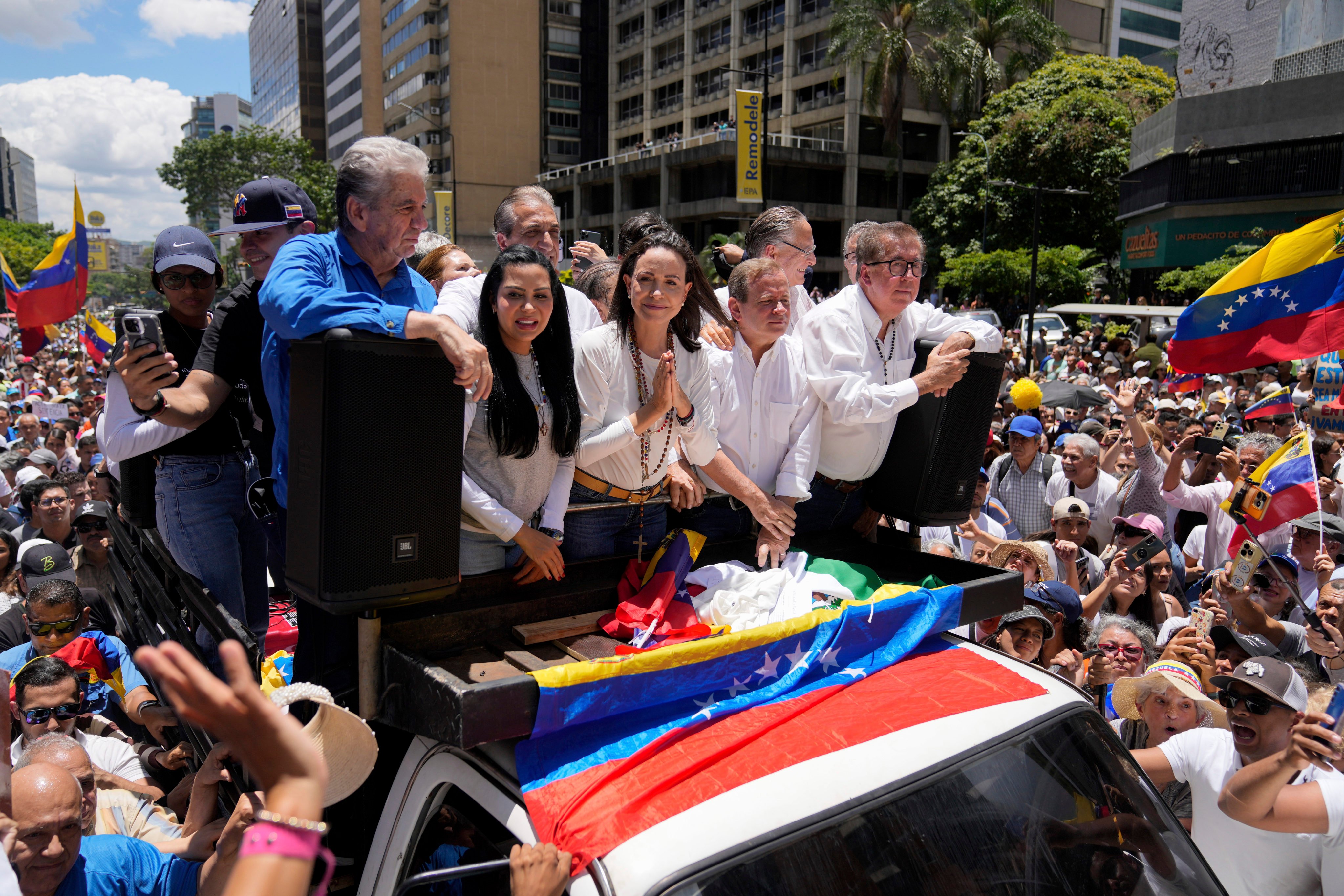 Maria Corina Machado, centre, leads a protest against the re-election of President Nicolas Maduro in Caracas, Venezuela. Photo: AP