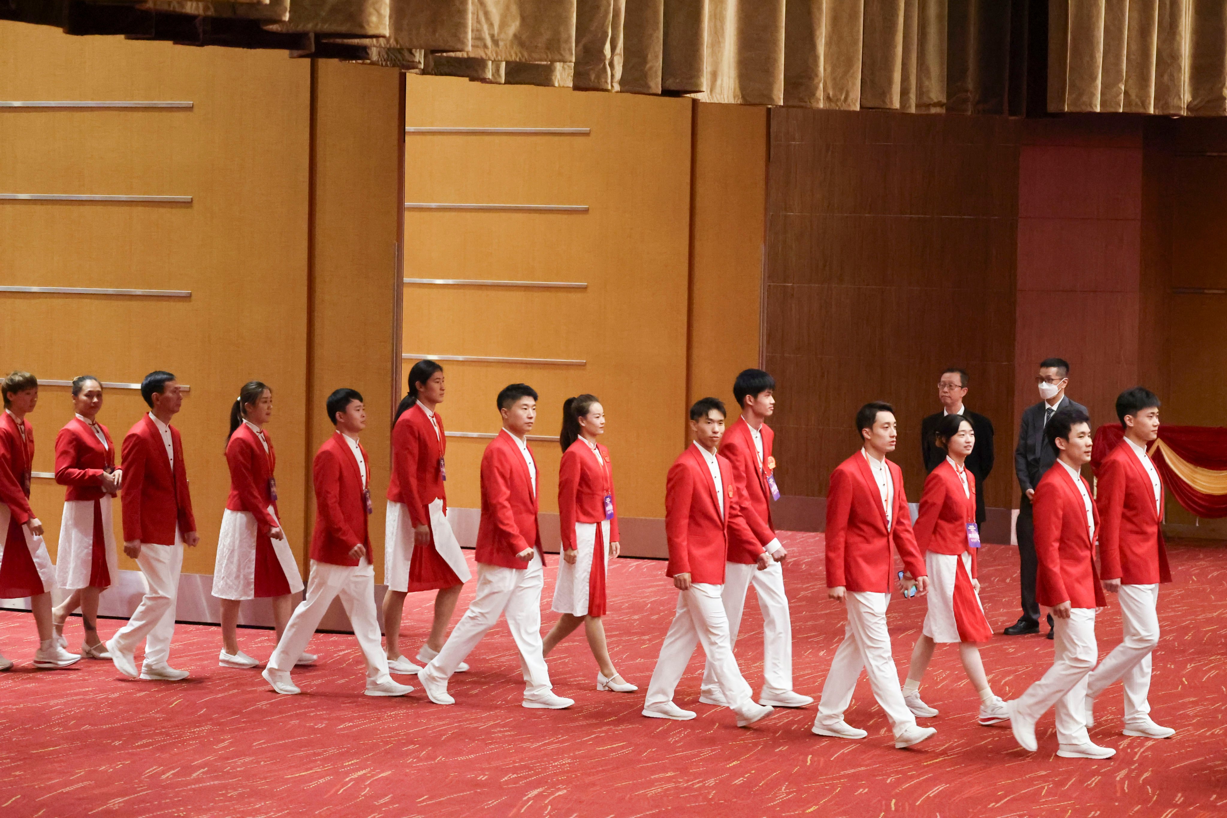 Athletes arrive for an official banquet at the Convention and Exhibition Centre. Photo: Dickson Lee