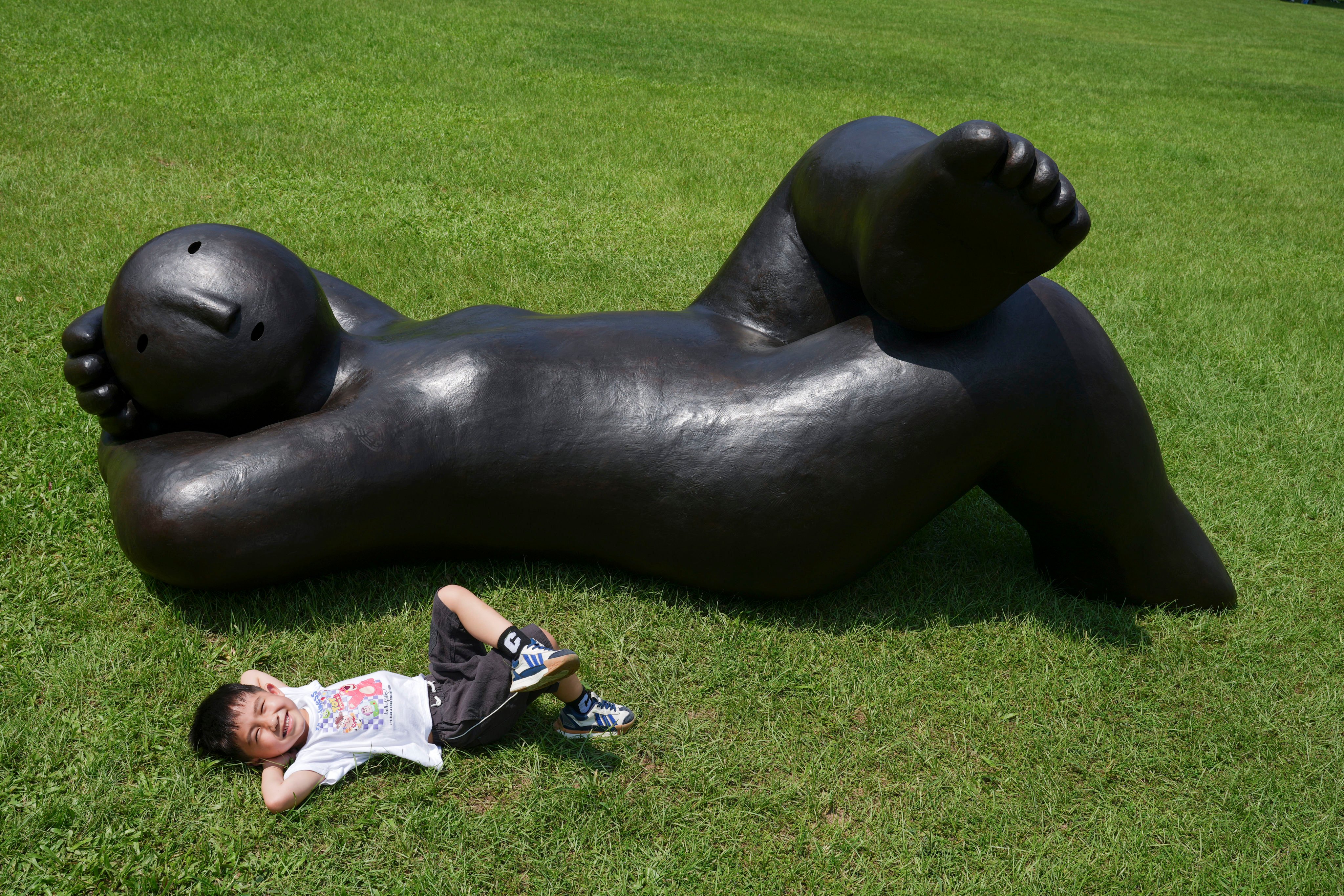 “Recliner Looking Up” is a sculpture on display at Victoria Park in Causeway Bay as part of the Art 021 Hong Kong art fair, one of several must-see arts events this weekend in the city. Photo: Sam Tsang