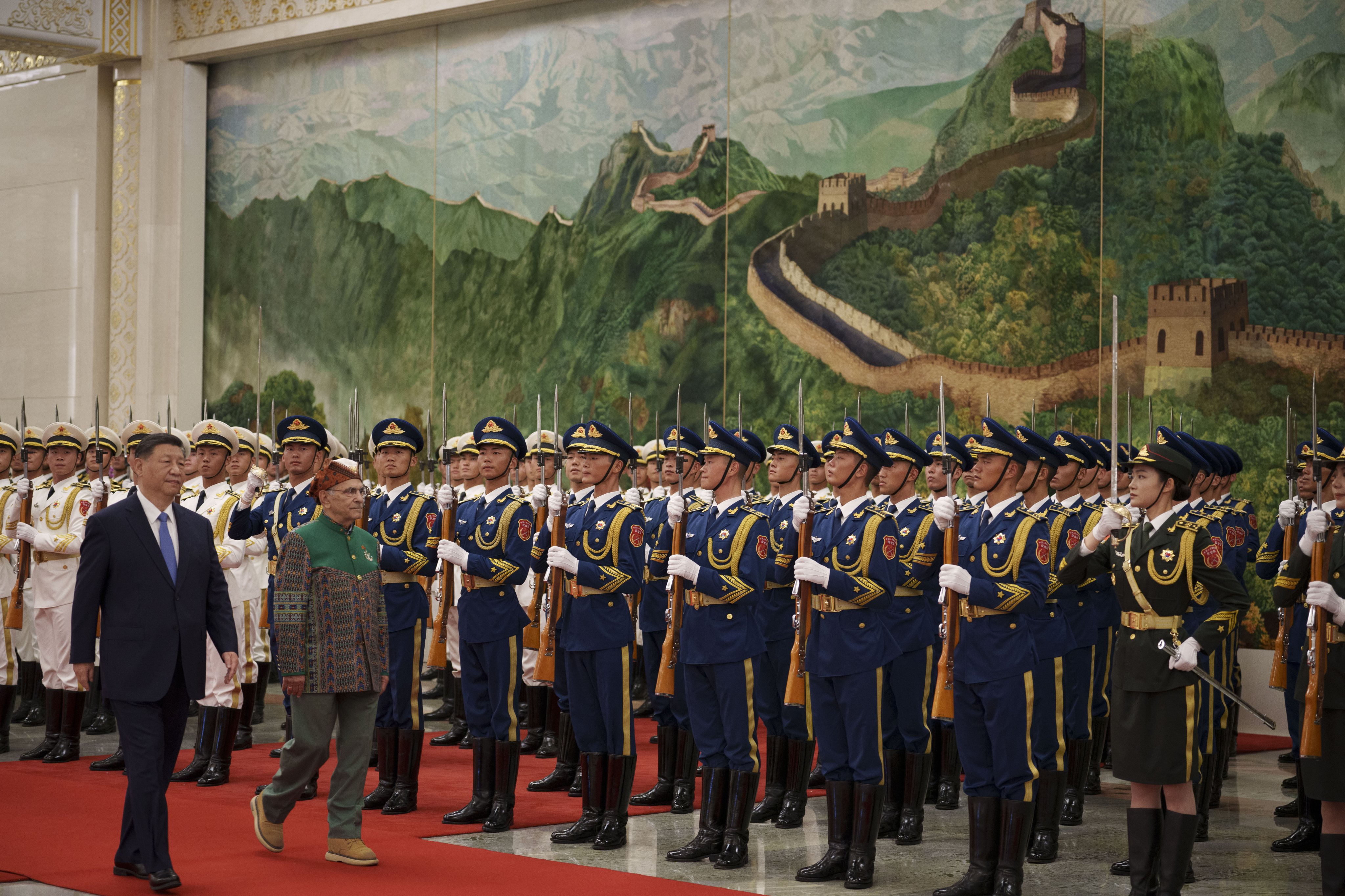 Chinese President Xi Jinping (left) and José Ramos-Horta inspect an honour guard during a welcome ceremony for the East Timor leader at Beijing’s Great Hall of the People in July. Photo: EPA