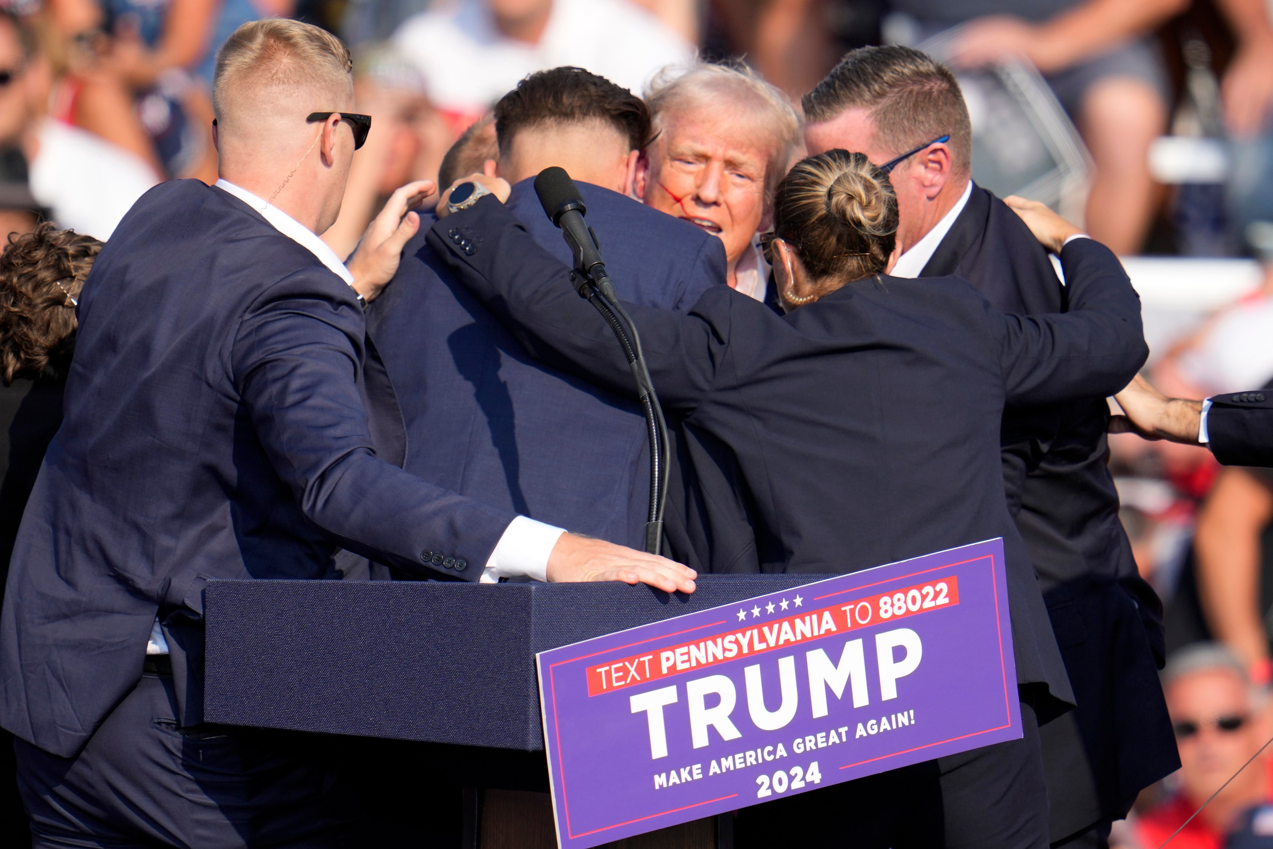 Republican presidential candidate and former US president Donald Trump is surrounded by Secret Service at a campaign event in Butler, Pennsylvania on July 13 after an assassination attempt. Photo: AP