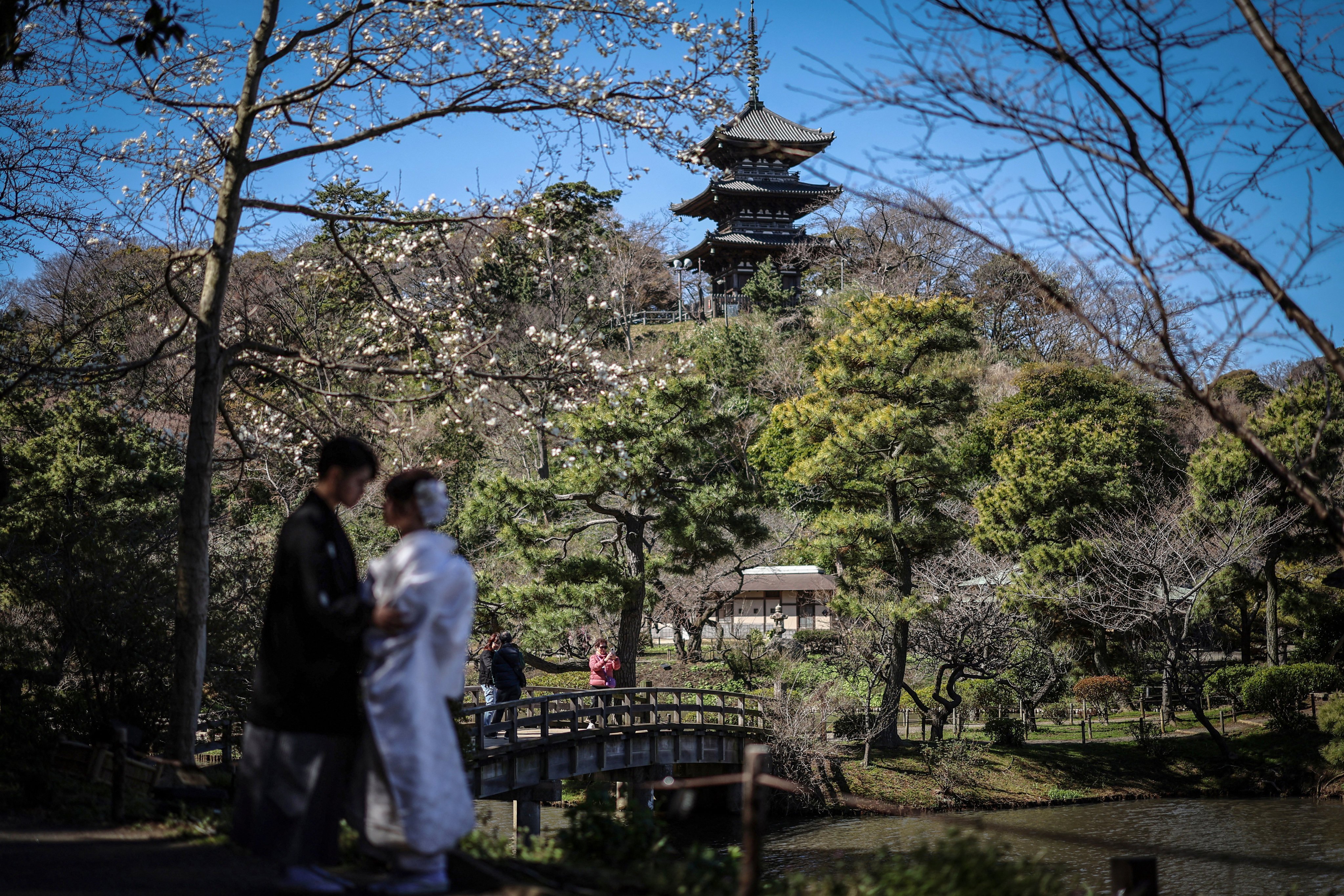 A couple pose for their wedding photos in Yokohama. More young women than young men leave villages and small towns they grew up in and move to big cities, especially Tokyo, for better opportunities in higher education and work. Photo: Reuters