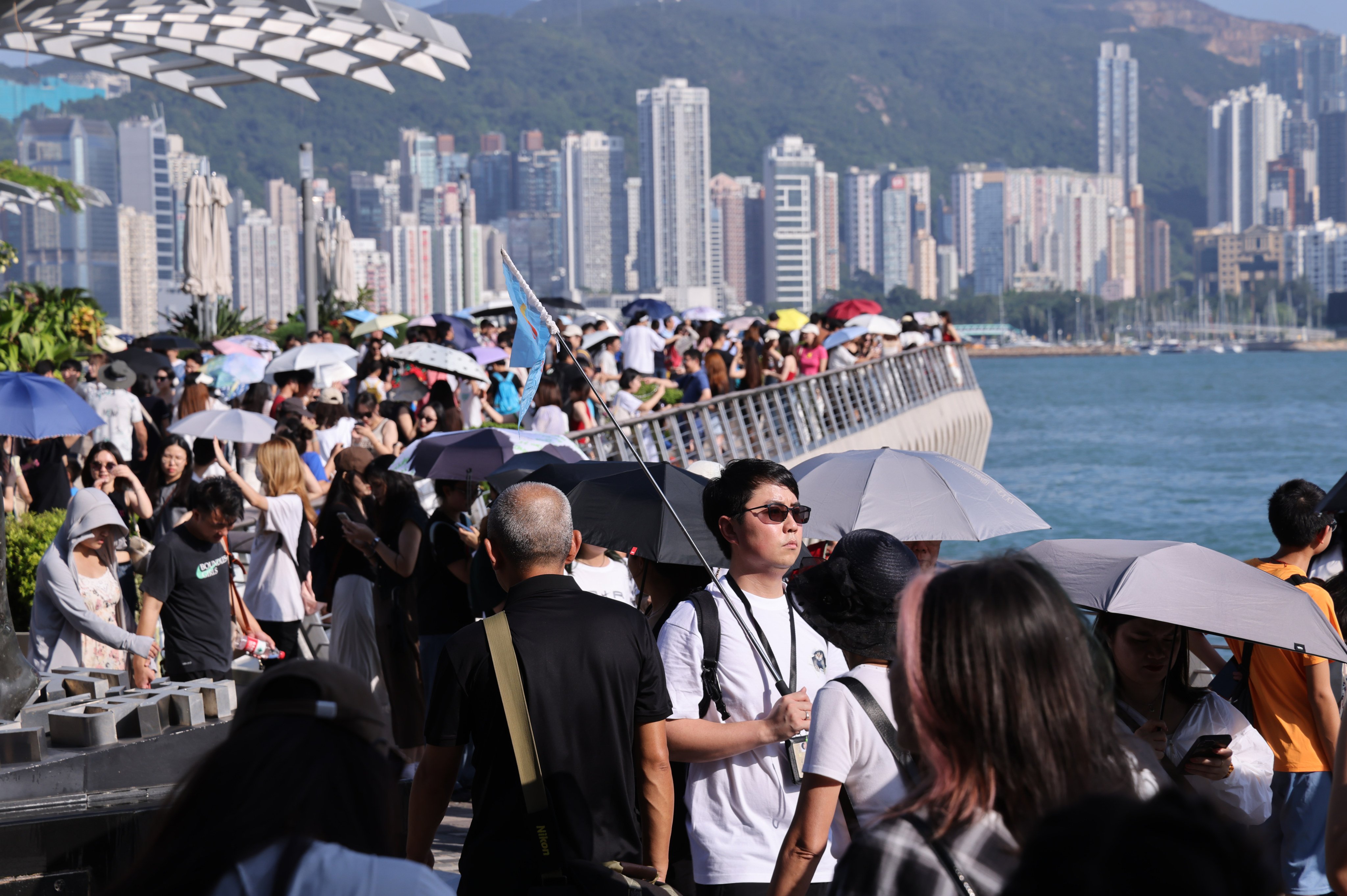 Tourists crowd the Avenue of the Stars at Victoria Harbour in Tsim Sha Tsui during the ‘Golden Week’ holiday period on October 2, 2023. Photo: May Tse