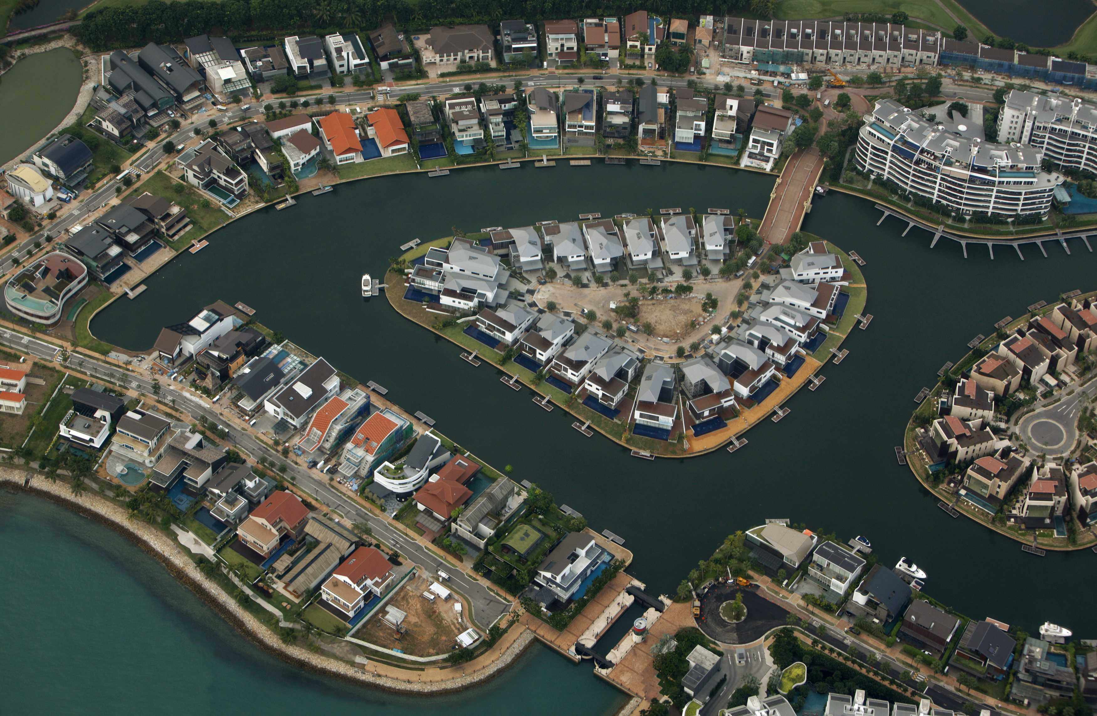 Luxury homes in Sentosa Cove. The exclusive enclave is mostly made up of reclaimed land. Photo: Reuters