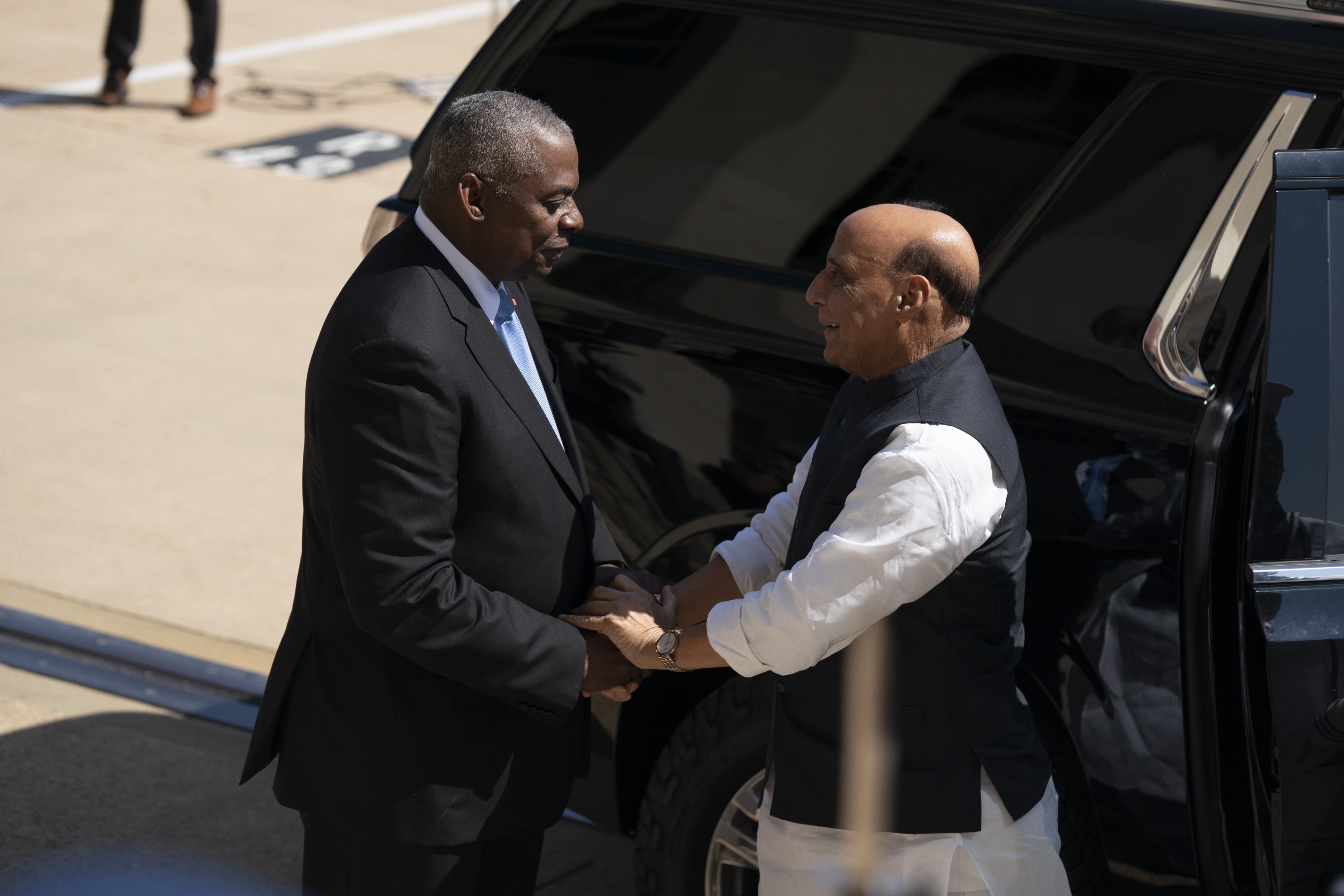 US Defence Secretary Lloyd Austin greets India’s Defence Minister Rajnath Singh before a meeting at the Pentagon on August 23. Photo: EPA-EFE