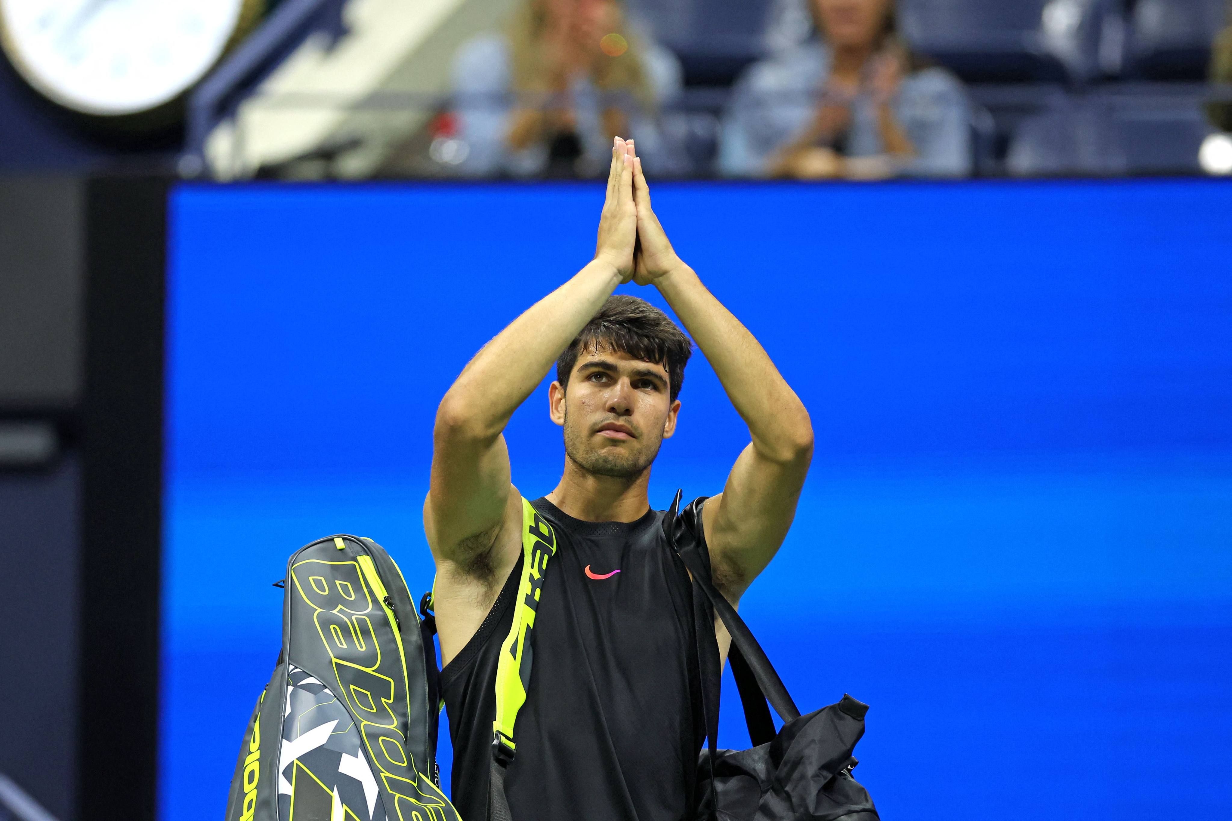 Carlos Alcaraz acknowledges the crowd after his surprise defeat to unseeded Dutchman Botic van de Zandschulp in the US Open second round. Photo: AP