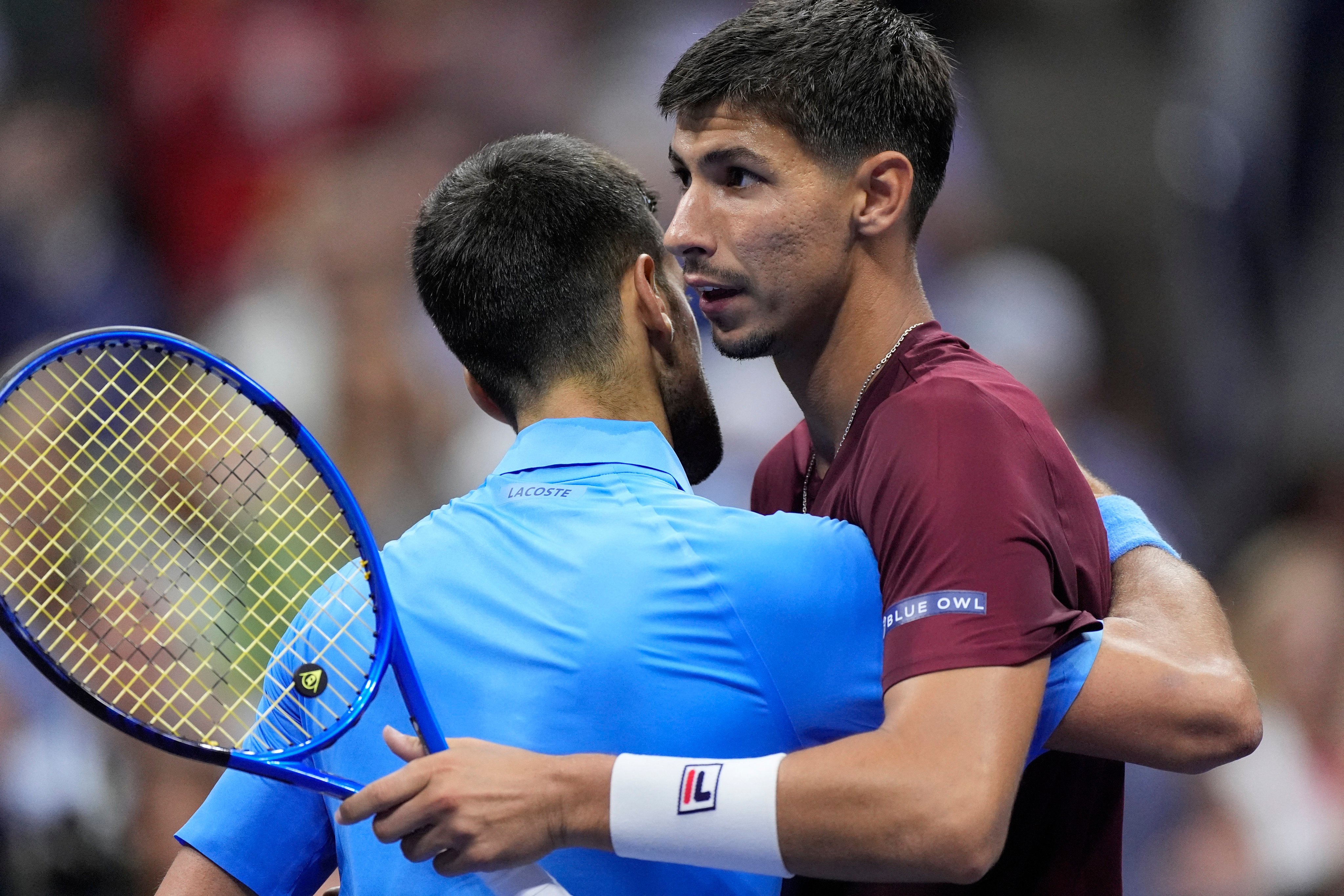 Novak Djokovic embraces Alexei Popyrin after the defending US Open champion’s shock defeat in the third round. Photo: Reuters