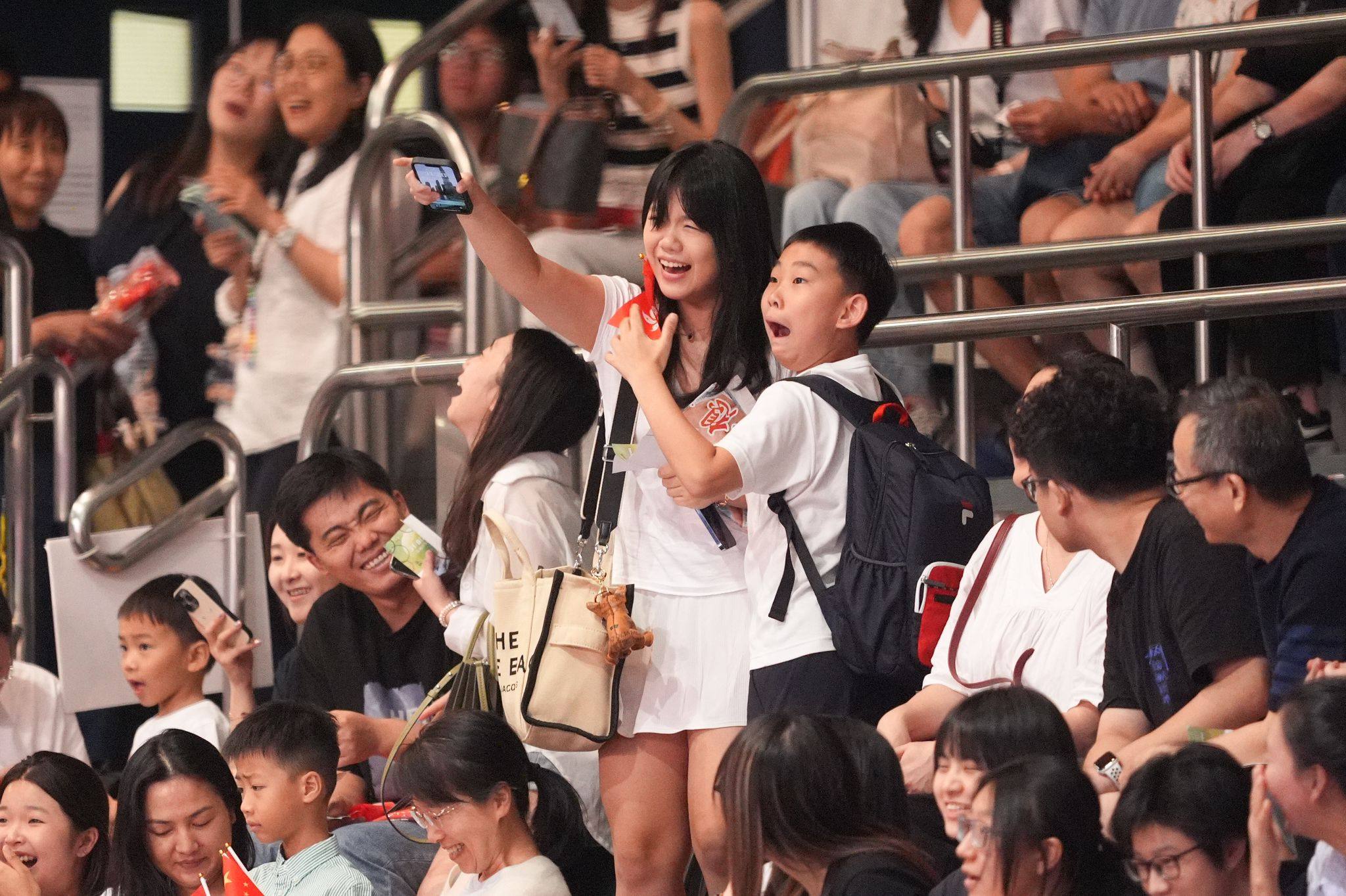 A couple of youngsters at Queen Elizabeth Stadium can’t hide their delight. Photo: Eugene Lee