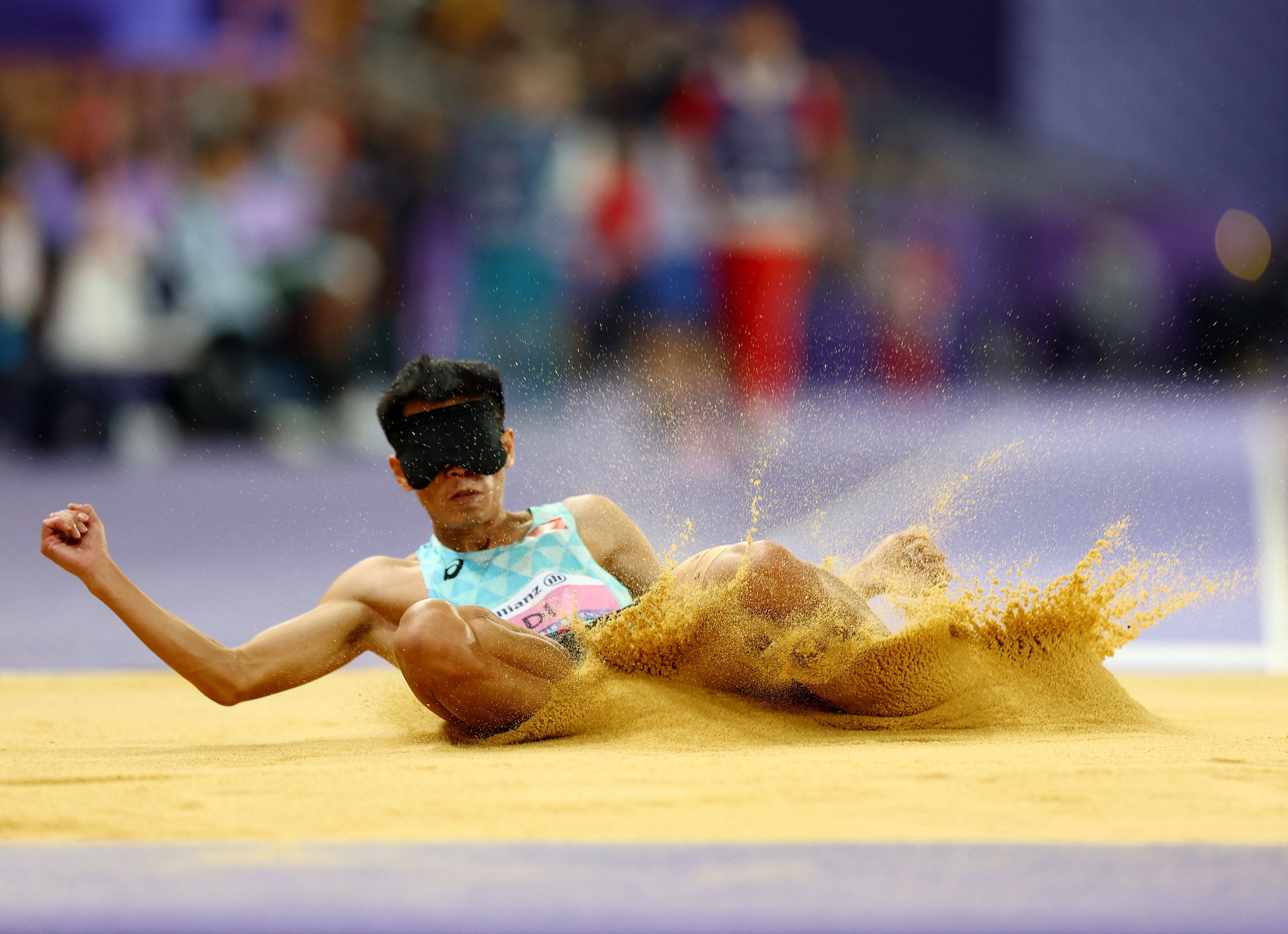 Di Dongdong won gold in the men’s T11 long jump with a world record leap of 6.85m. Photo: Reuters