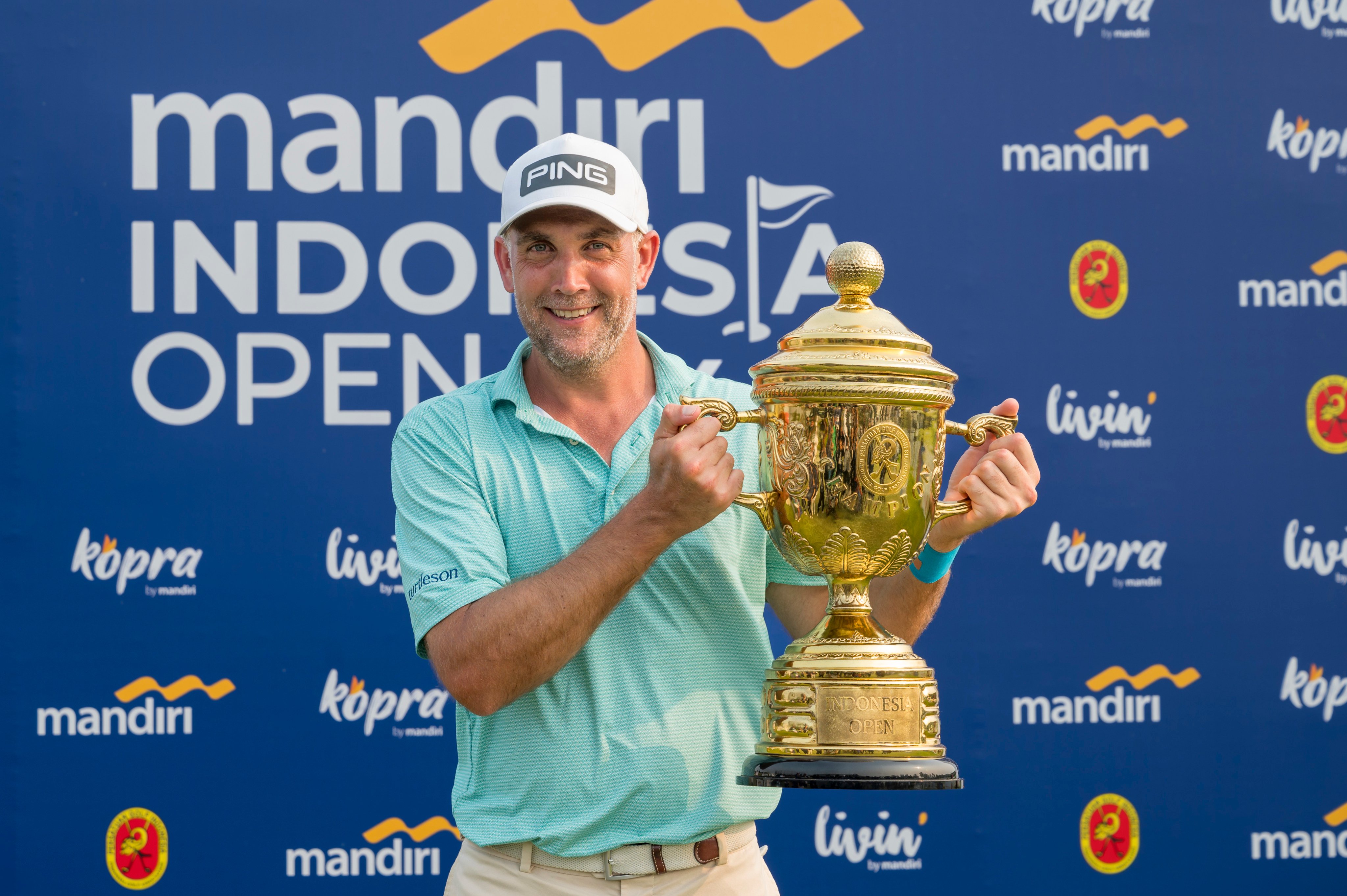 Steve Lewton holds the Indonesia Open winner’s trophy at Damai Indah Golf - PIK Course. Photo: Asian Tour