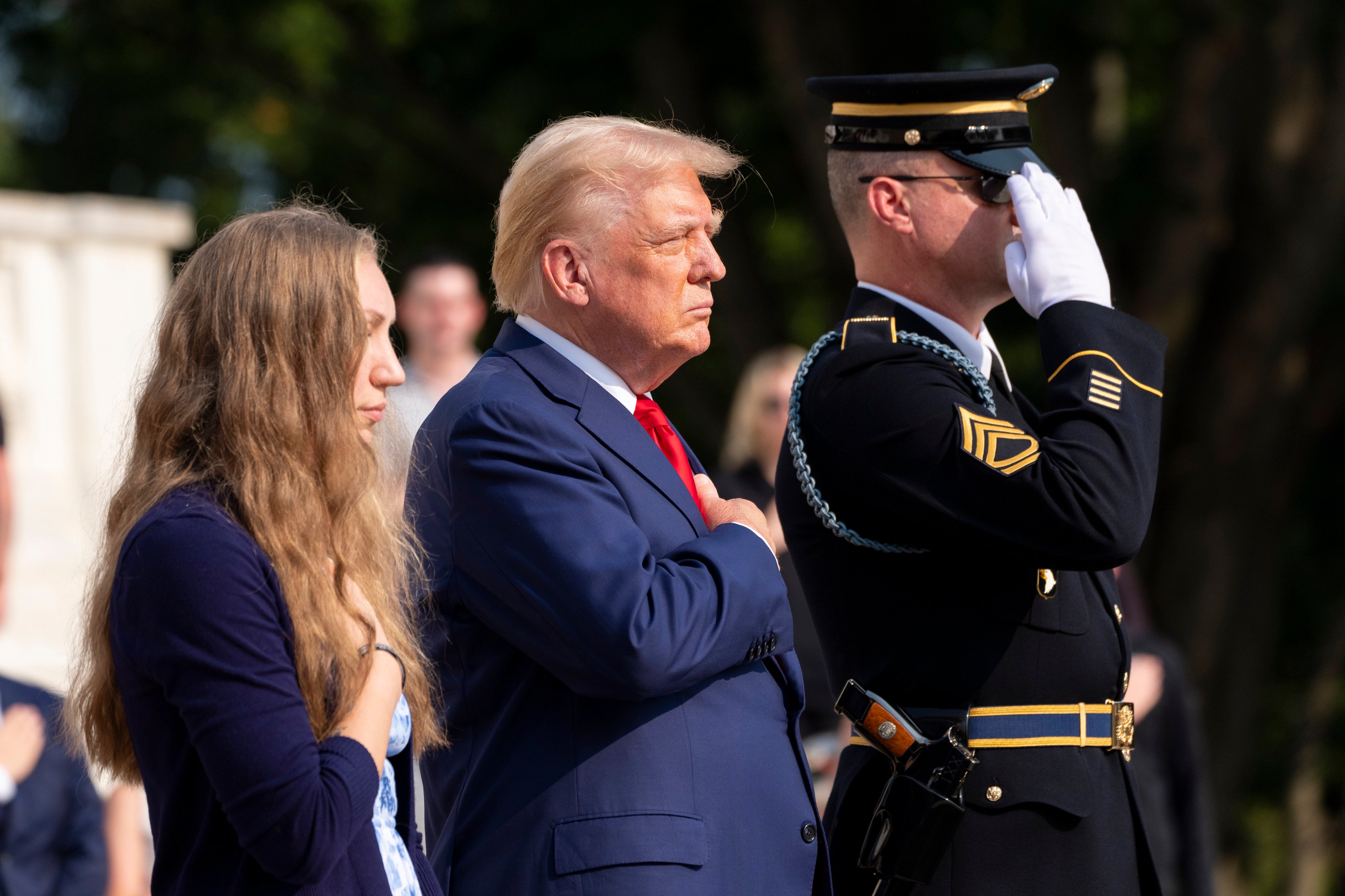 Republican US presidential nominee Donald Trump places his hands over his heart after placing a wreath in honour of Sergeant. Nicole Gee at the Tomb of the Unknown Solider at Arlington National Cemetery in Virginia on Monday. Photo: AP