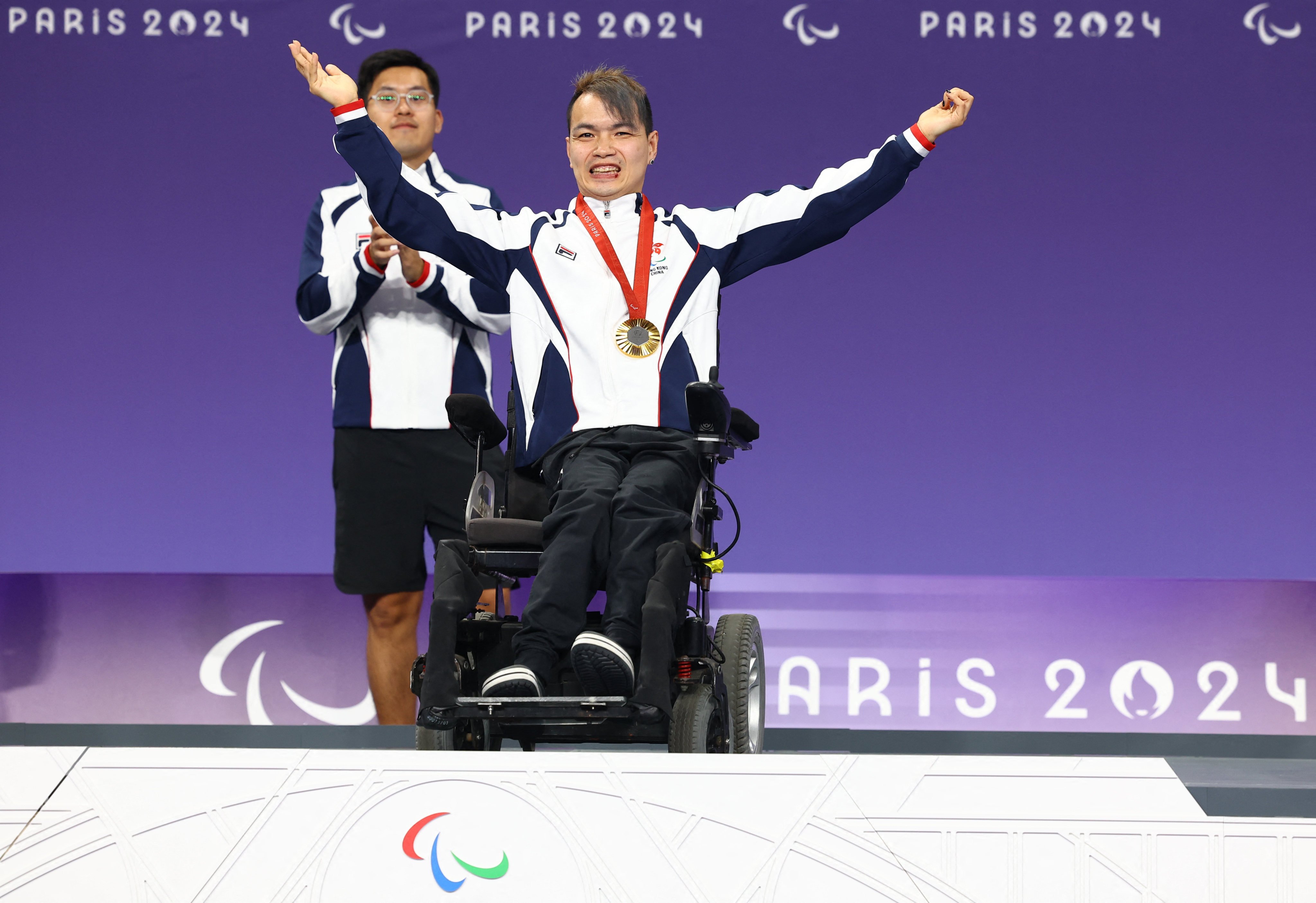 Hong Kong’s gold medallist John Loung celebrates. Photo: Reuters