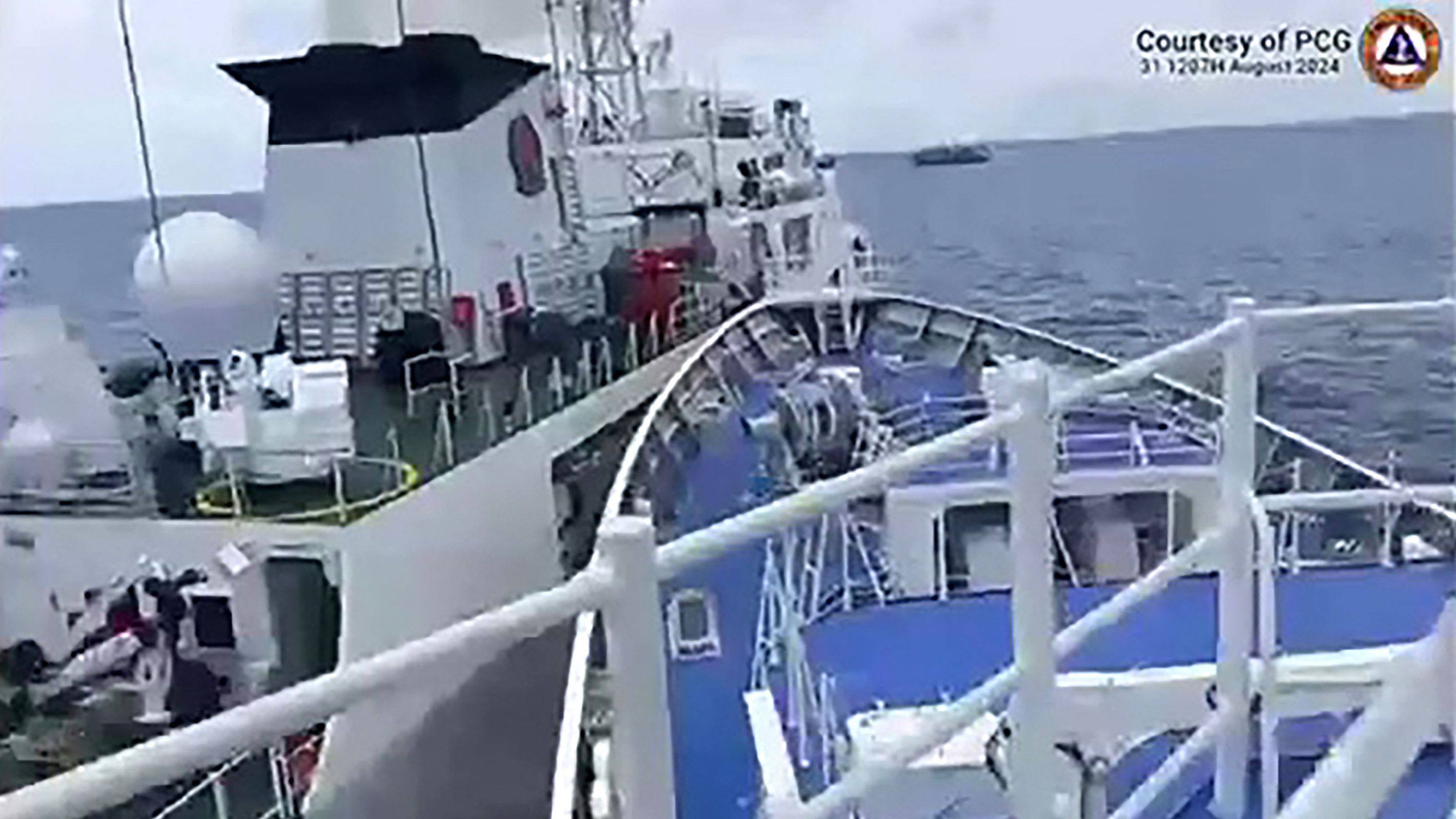 Chinese and Philippine coastguard vessels confront each other near Sabina Shoal on Sunday. Photo: AFP