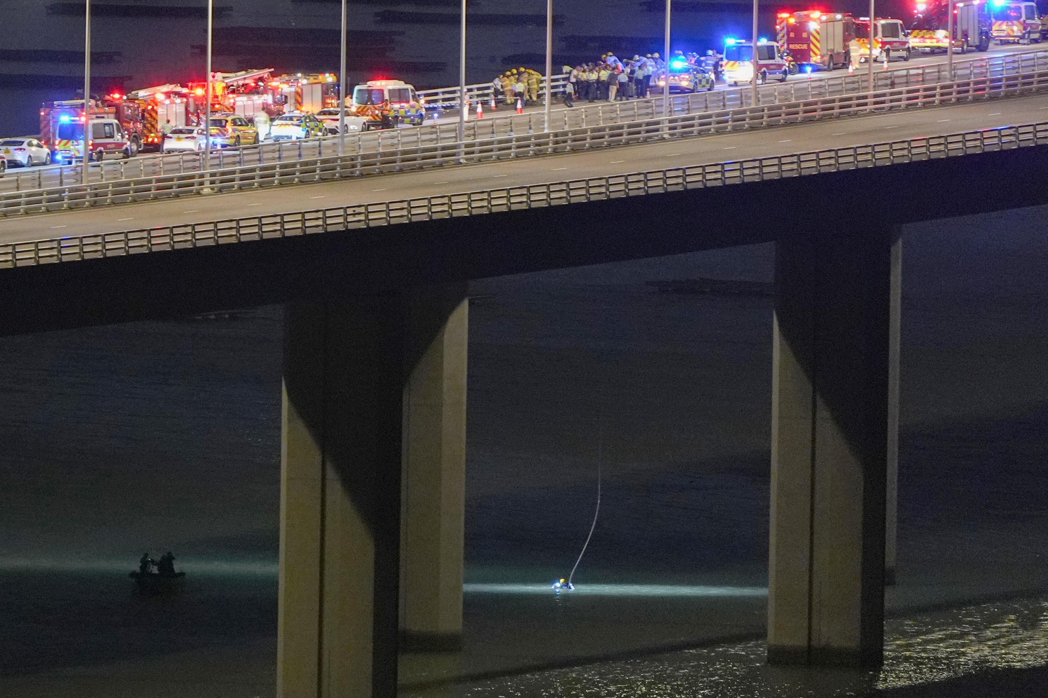 First responders on the bridge help oversee the rescue operation. Photo: Eugene Lee