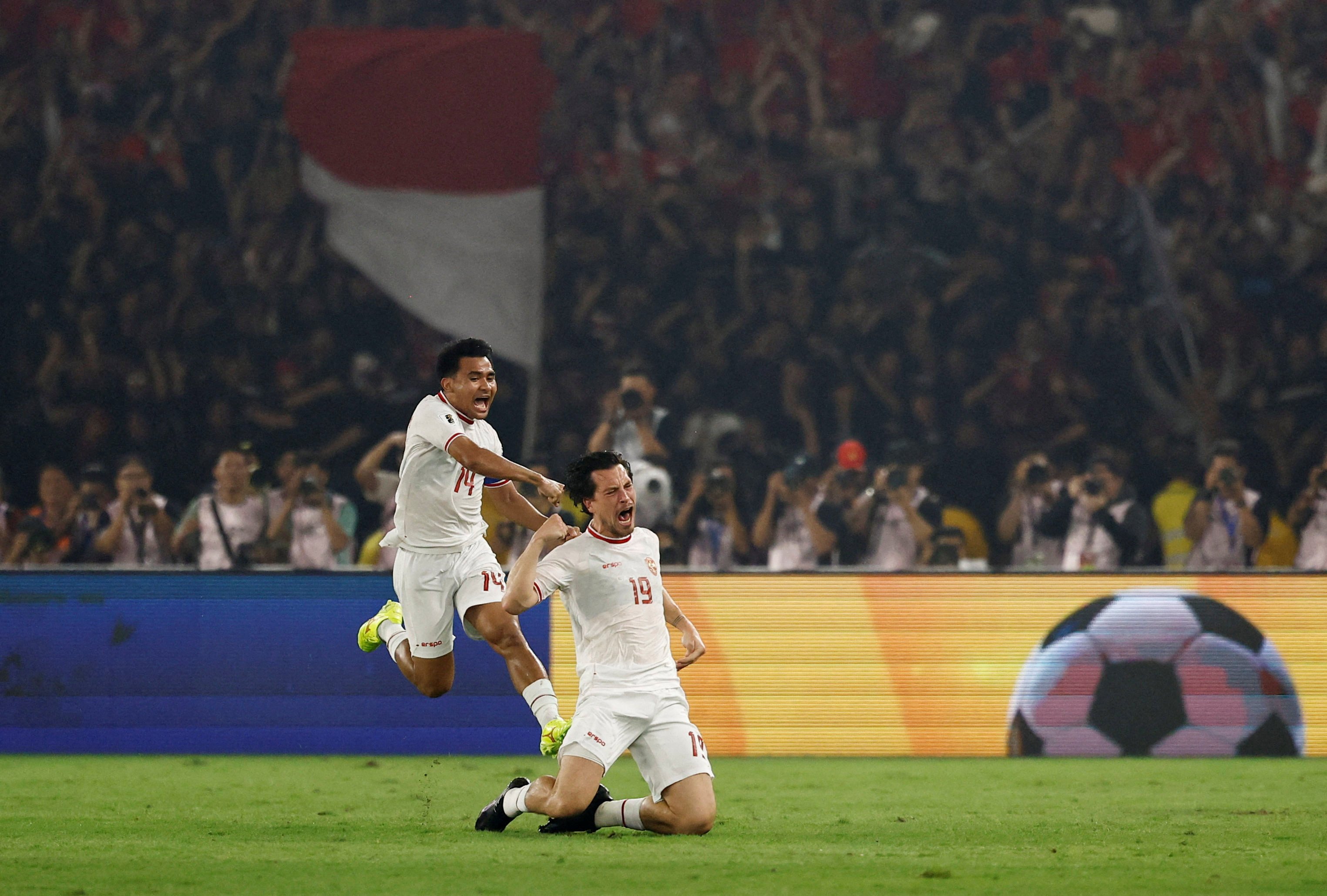 Indonesia’s Amsterdam-born midfielder Thom Haye (right) celebrates after scoring the first goal in their 2-0 win over the Philippines, with teammate Asnawi Mangkualam. Photo: Reuters