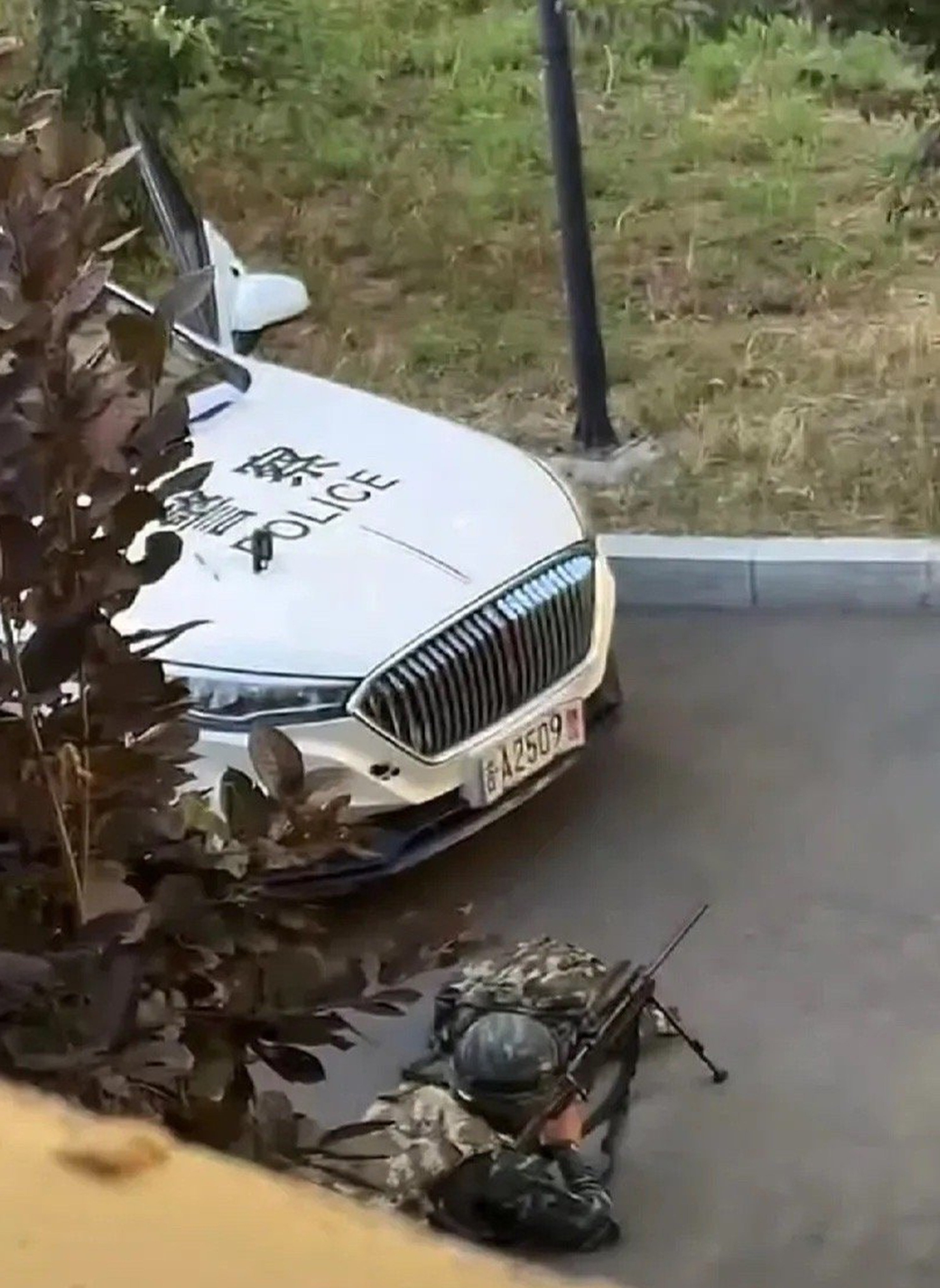 A police sniper lies in position during a deadly shoot-out in Changchun, Jilin province, on Monday. Photo: Handout