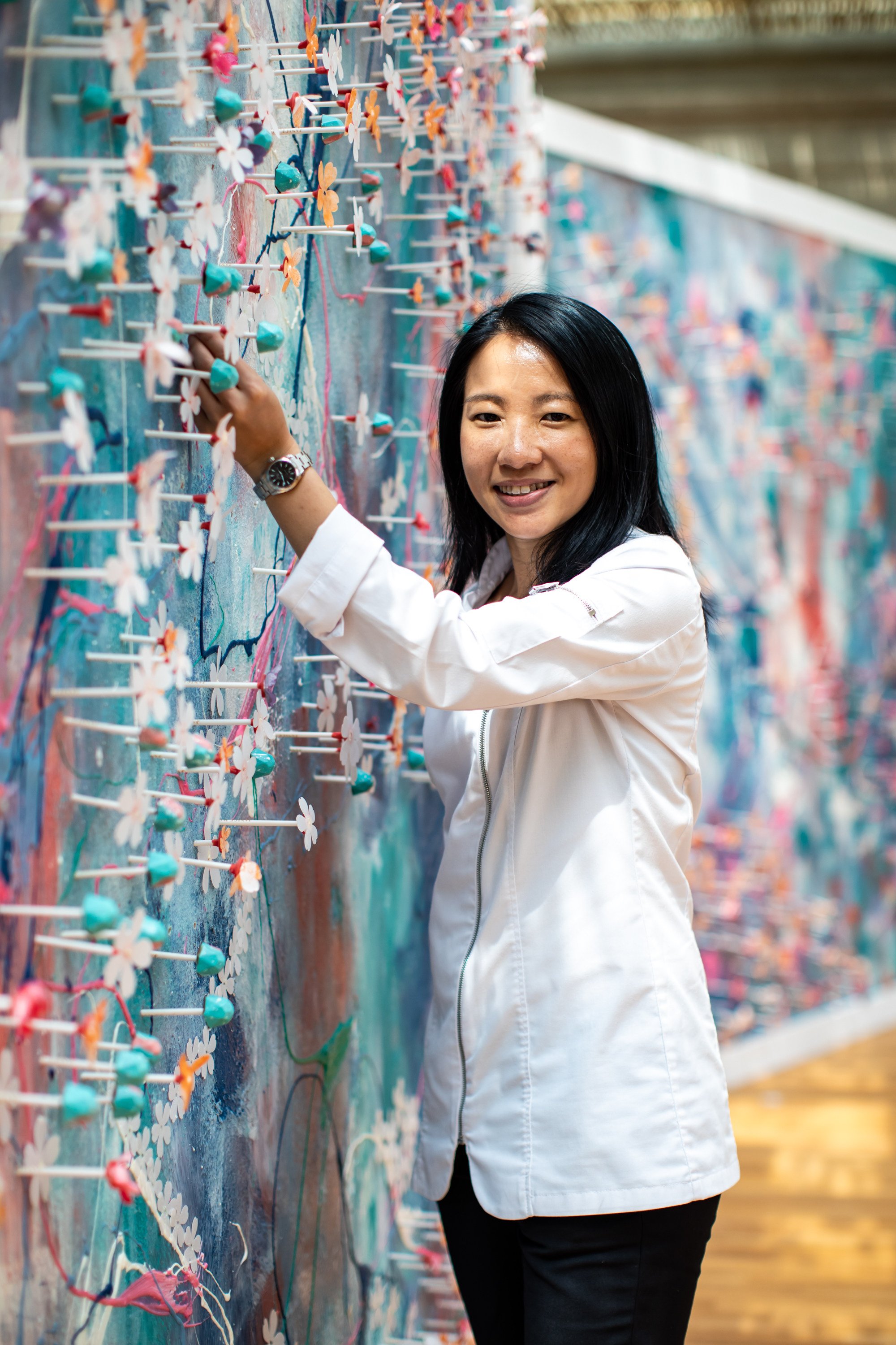 Janice Wong with one of her edible chocolate art walls. Photo: courtesy of Janice Wong