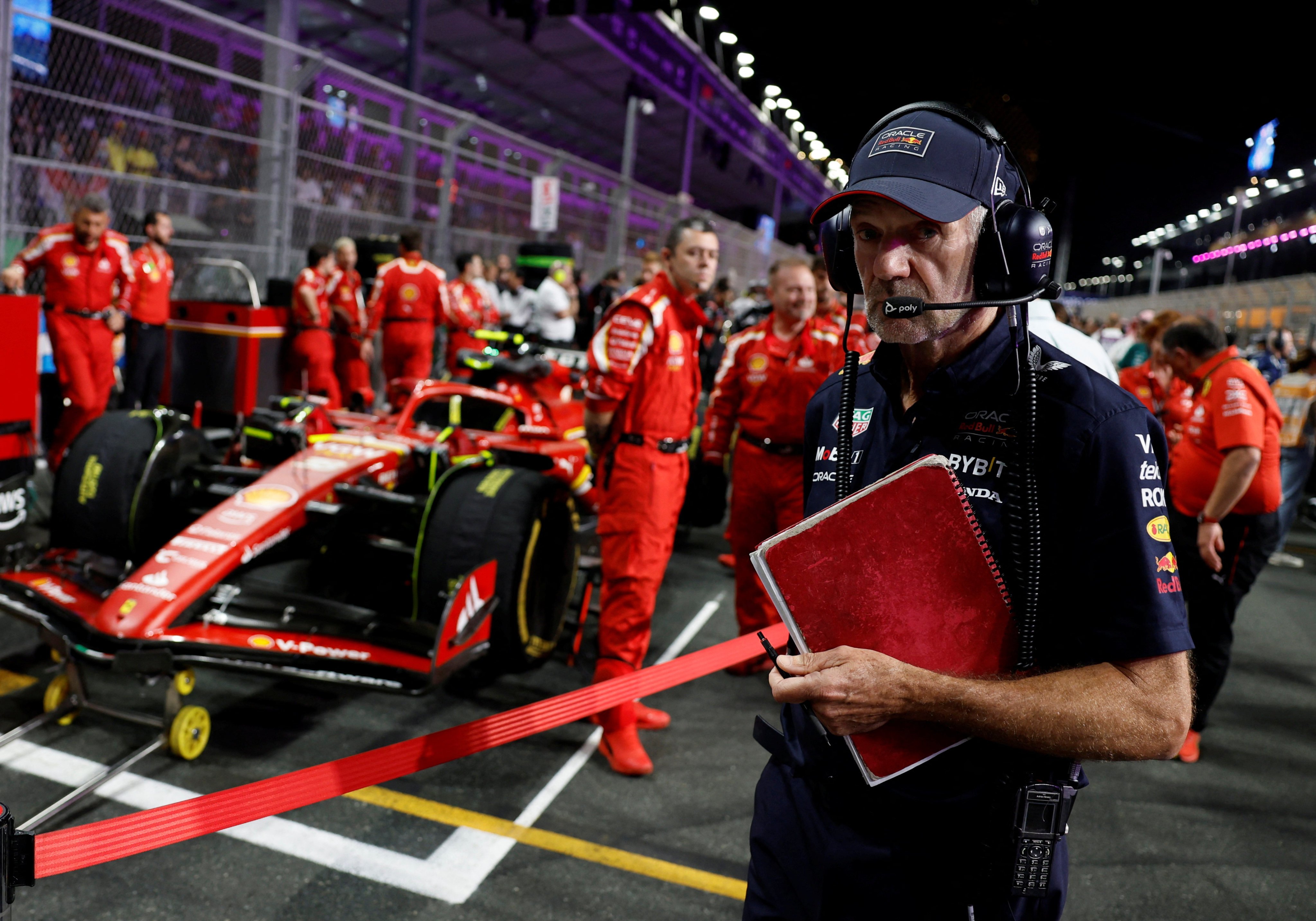 Formula One F1 - Saudi Arabian Grand Prix - Jeddah Corniche Circuit, Jeddah, Saudi Arabia - March 9, 2024 
Red Bull’s chief technology officer Adrian Newey with Ferrari engineers and Carlos Sainz Jr’s car before the 2024 Saudi Arabian Grand Prix. Photo: Reuters