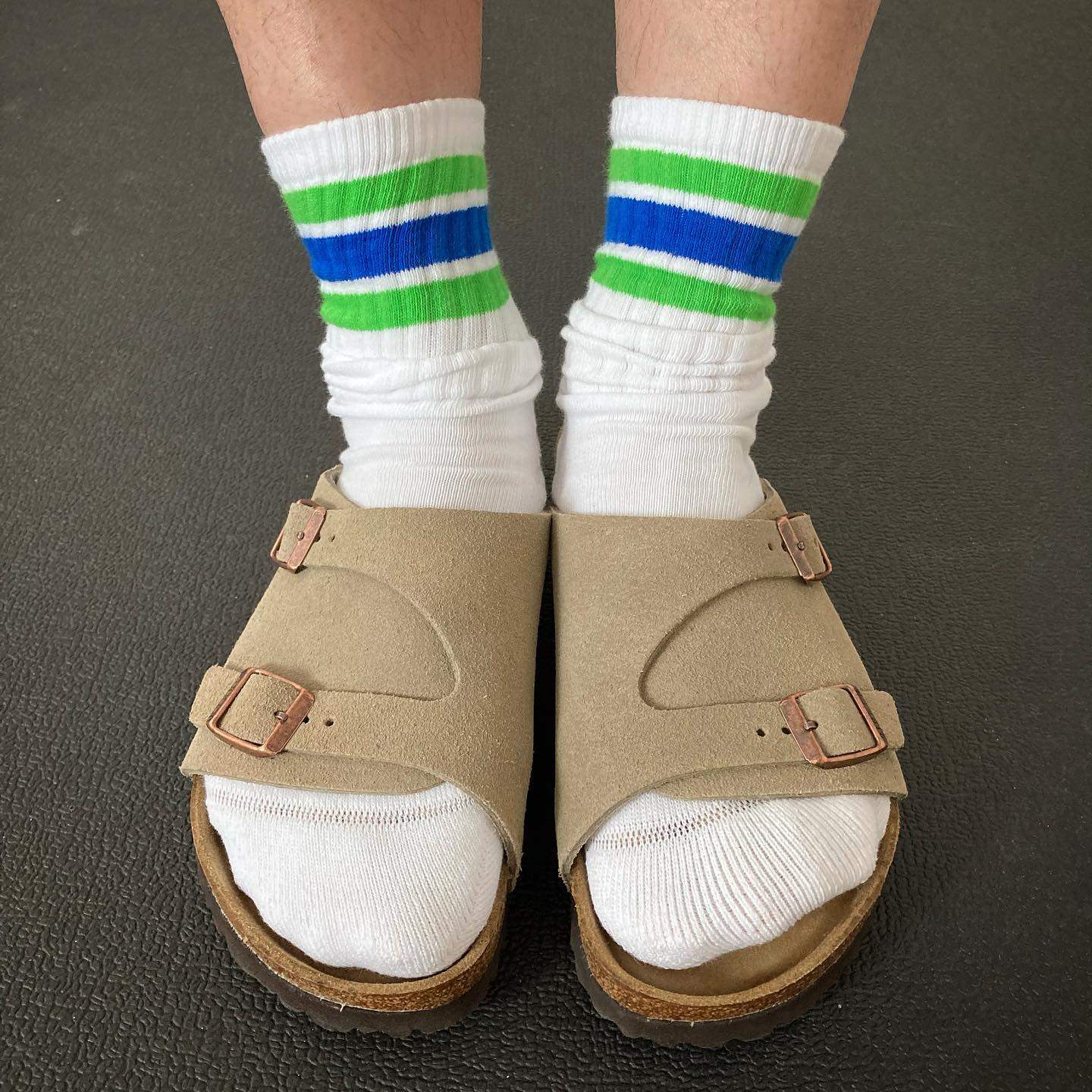 A pair of FamilyMart socks in its signature colours. Japanese convenience stores are becoming must-visit tourist spots for their fashion lines. Photo: Instagram/@t.sugi23