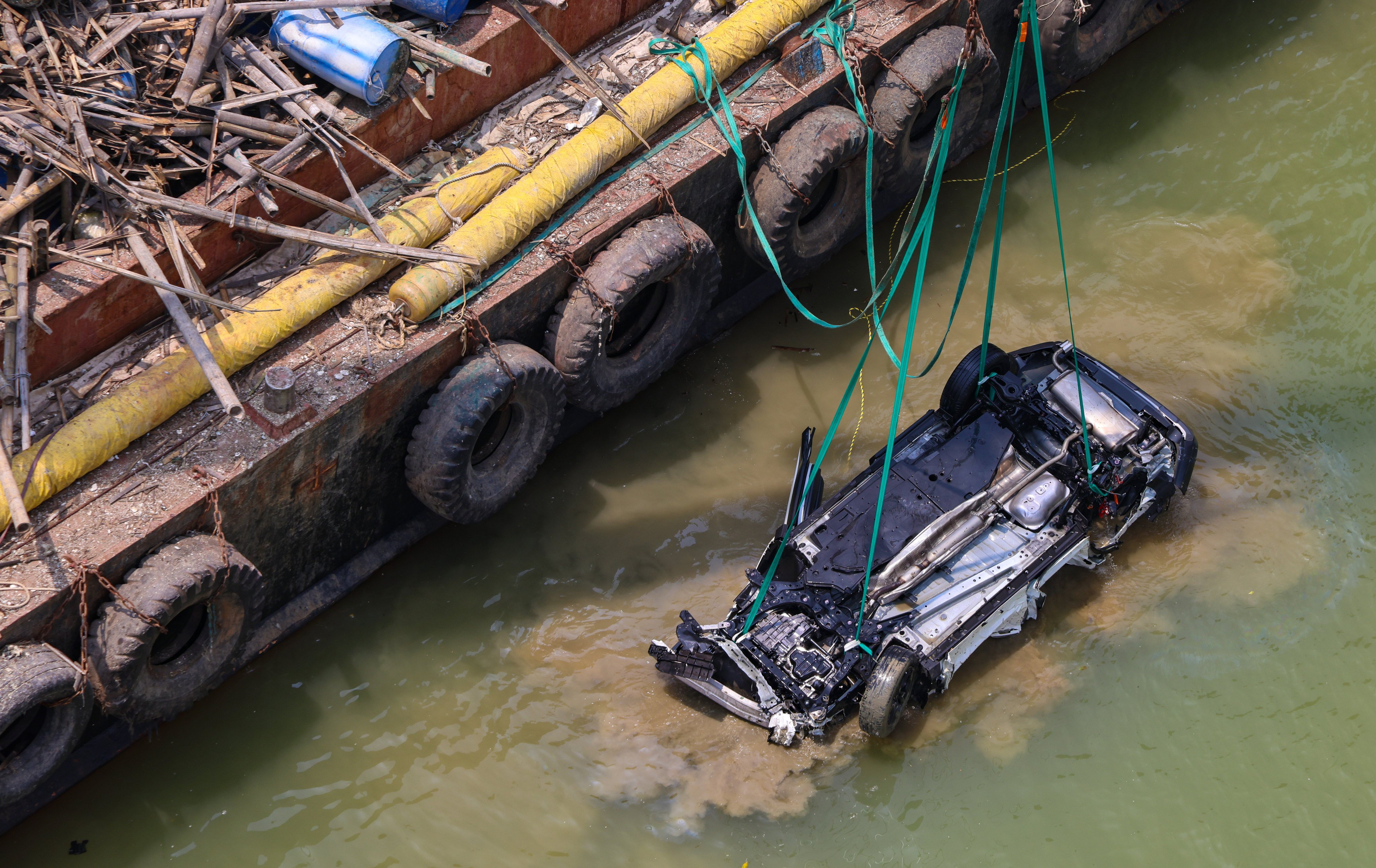 The car was recovered from the waters beneath the bridge shortly after midday on Tuesday. Photo: Jelly Tse