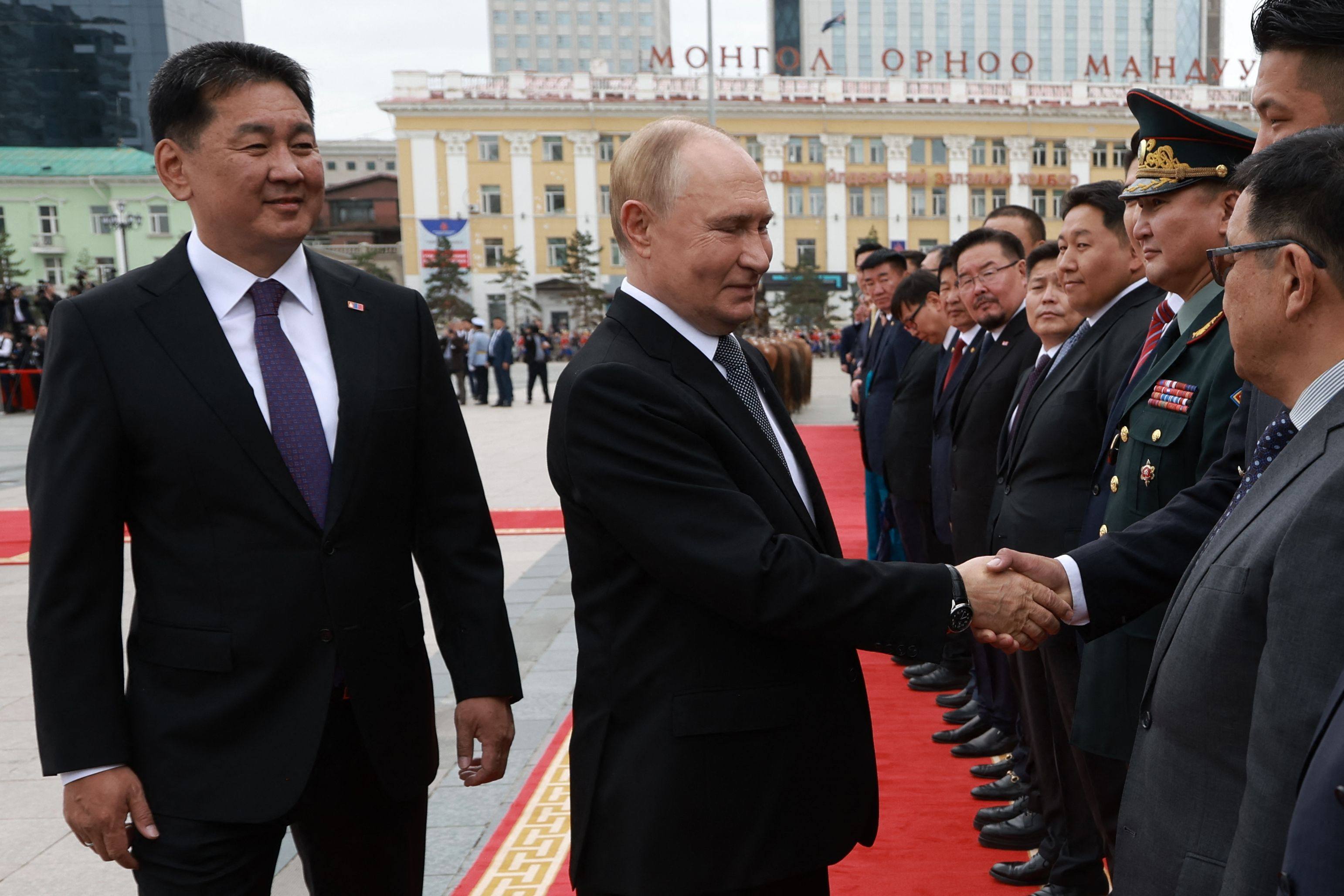 Russia’s President Vladimir Putin and Mongolia’s President Ukhnaagiin Khurelsukh attend an official welcoming ceremony in Ulaanbaatar on September 3. Photo: Pool/AFP