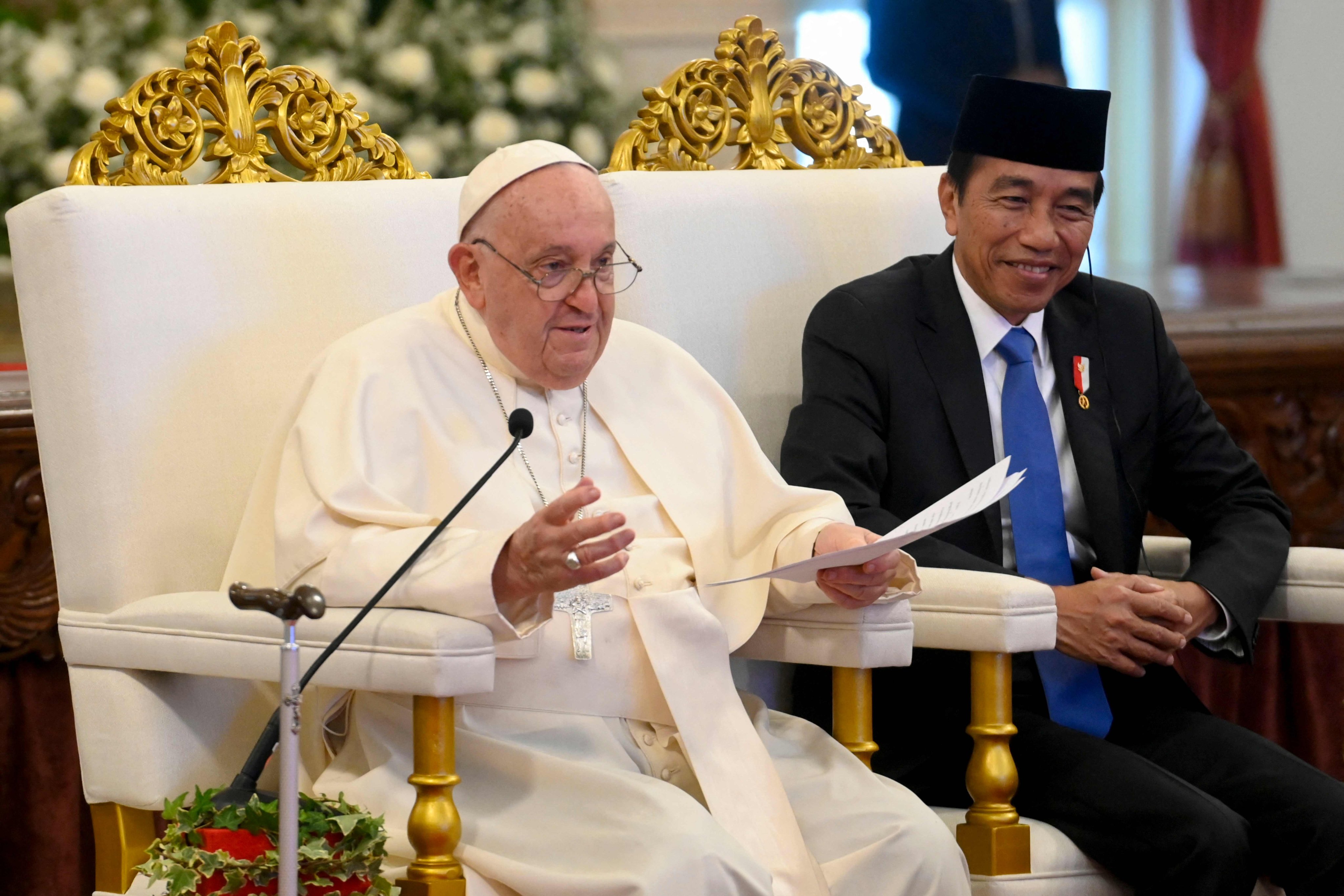 Pope Francis (left) delivers his address as Indonesia’s President Joko Widodo looks on during a meeting with Indonesian authorities, at the Presidential Palace in Jakarta on Wednesday. Photo: Vatican Media/AFP