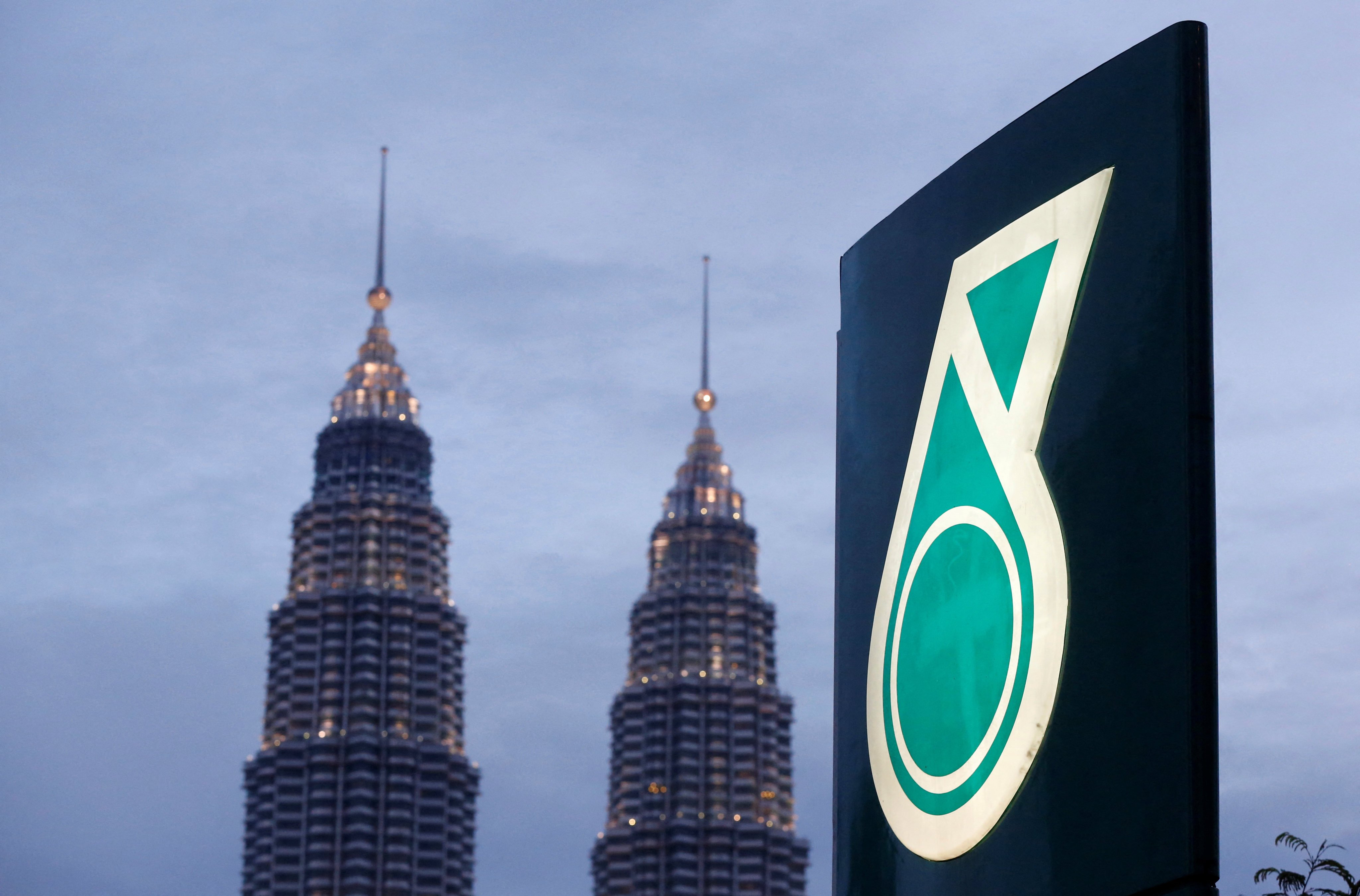 The logo of is seen with the Petronas Twin Towers in Kuala Lumpur. Petronas operates oil and gas fields in the South China Sea within Malaysia’s economic zone and has in recent years had several encounters with Chinese vessels. Photo: Reuters