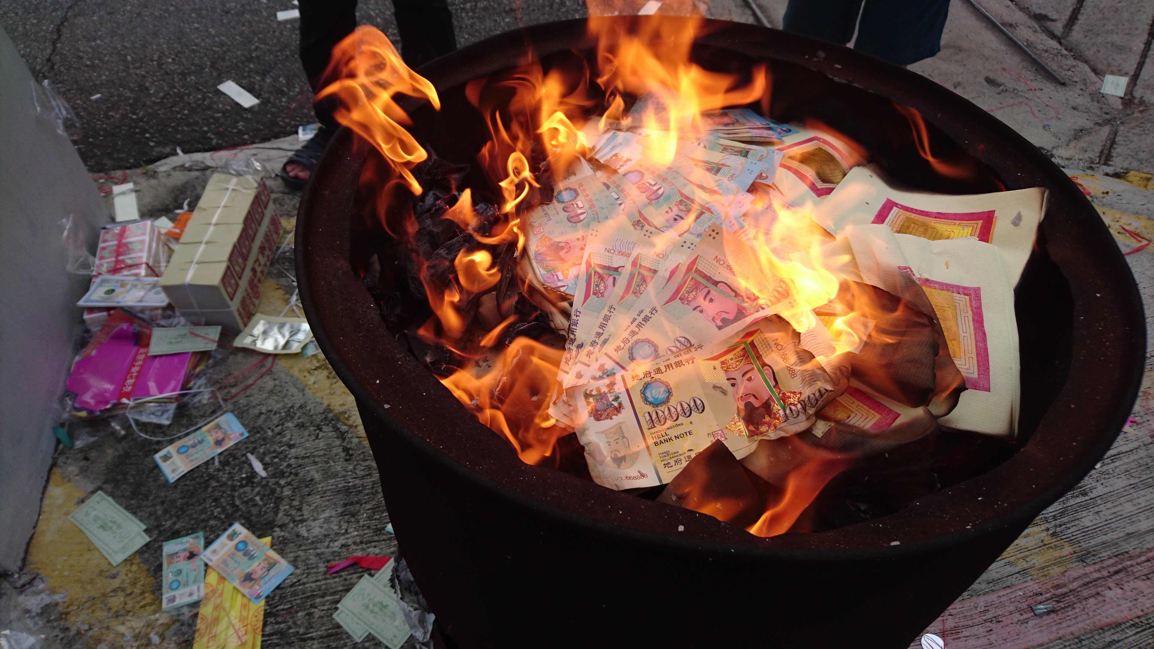 Singapore tackles public cleanliness issues during Hungry Ghost festival, as devotees face criticism for littering after offerings burning. Photo: Shutterstock