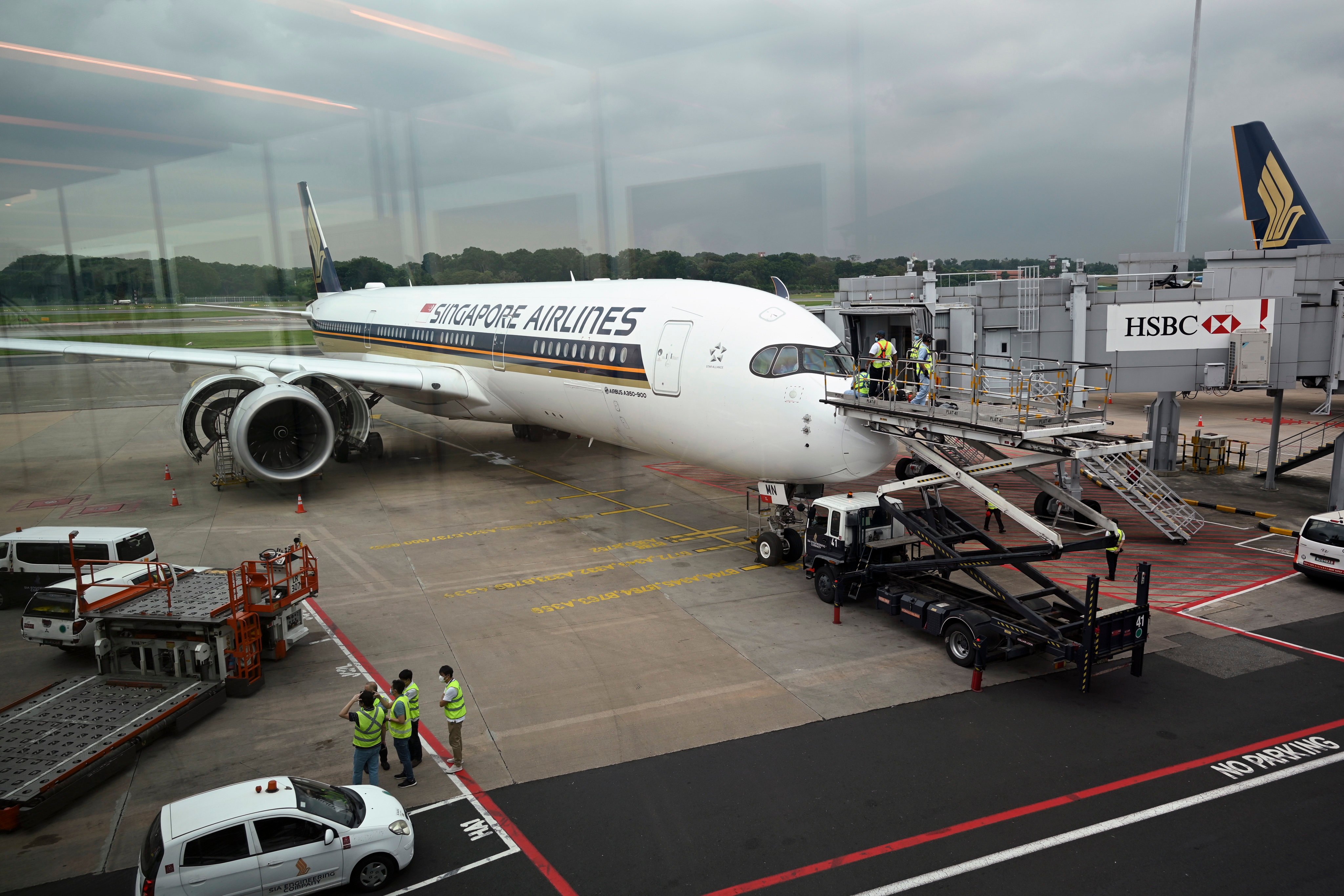 Technicians check a Singapore Airlines Airbus A350 aircraft at Changi International Airport. Photo: AFP