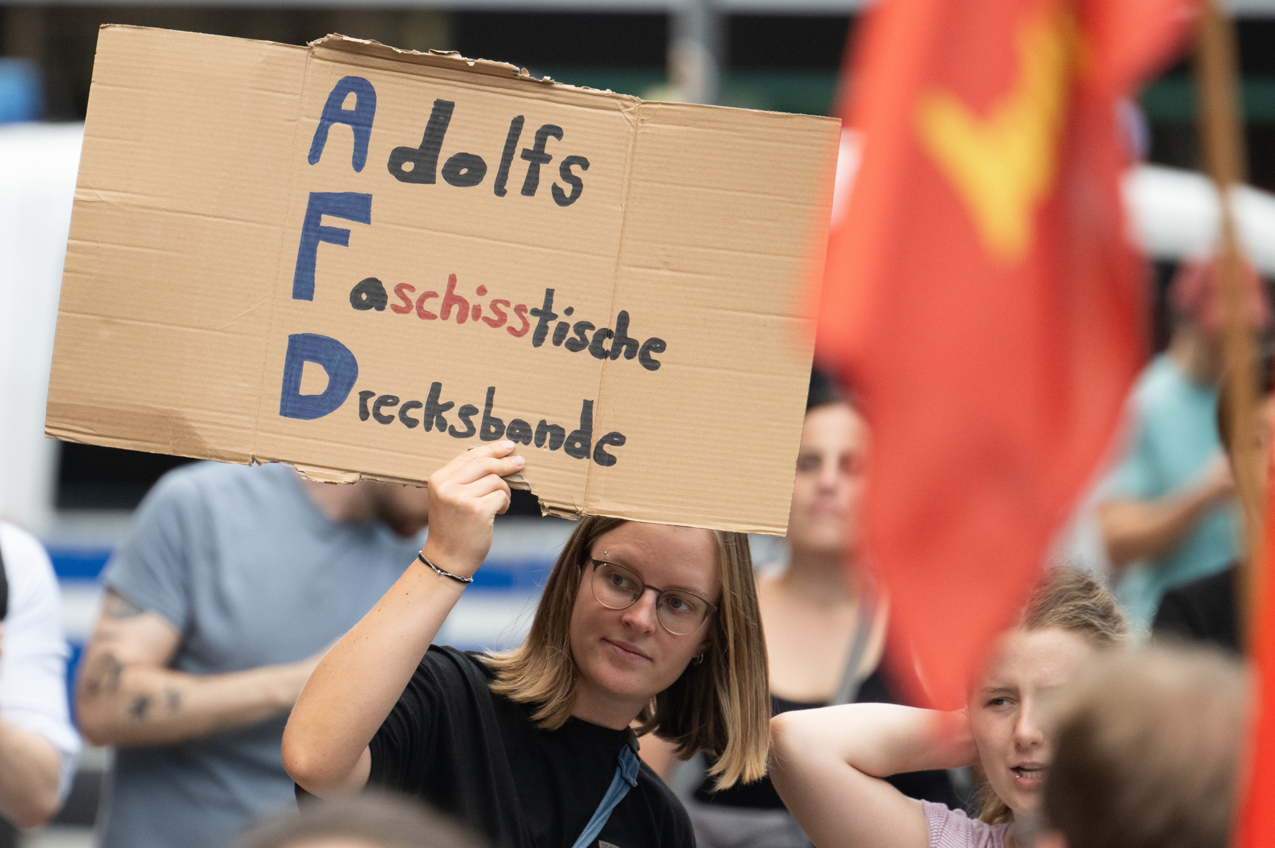 A woman protests against racism and the politics of the AfD that has little chance of entering government in Thuringia or elsewhere for now as all other political parties have refused to ally with it to form a government. Photo: dpa