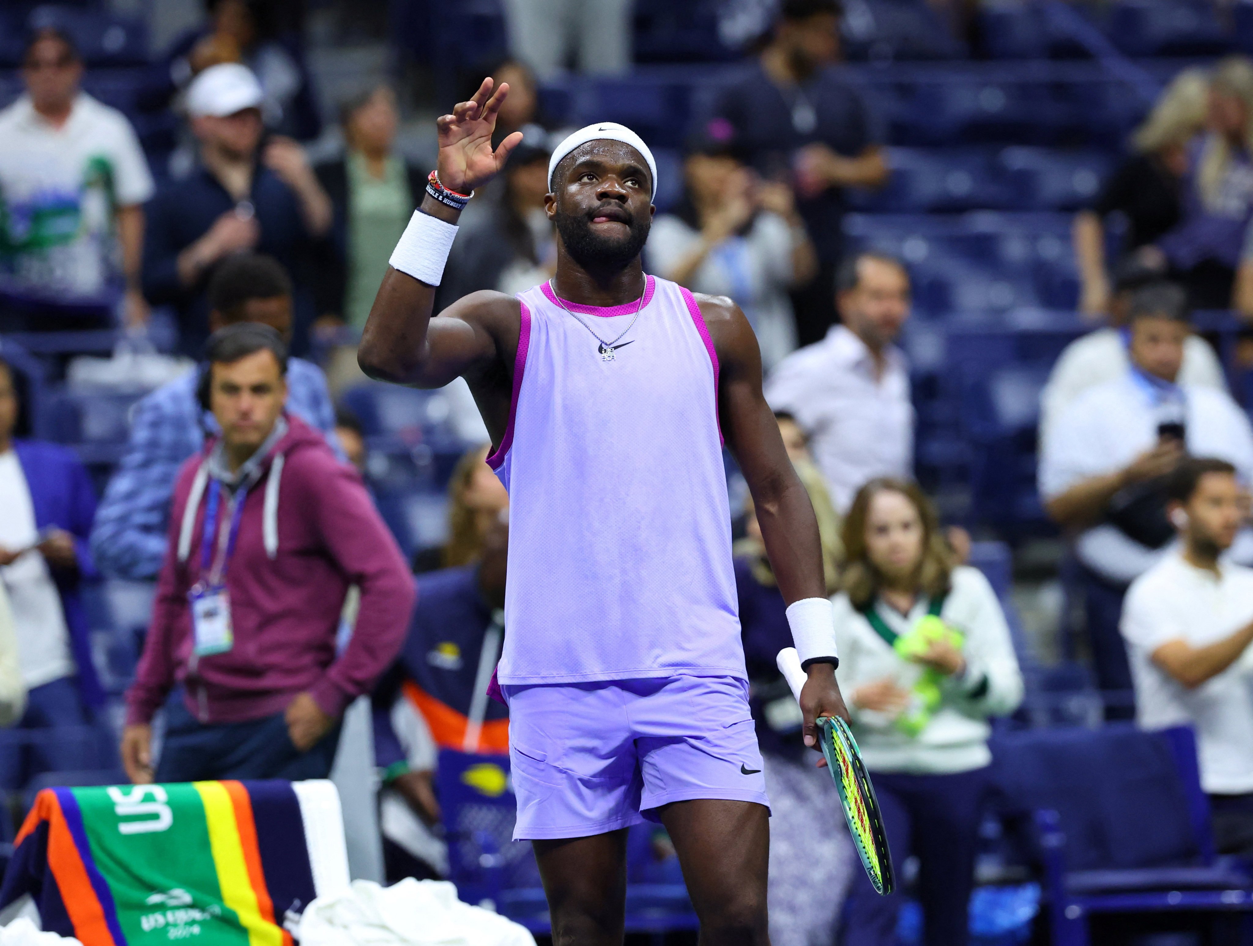 Frances Tiafoe of the US in muted celebration after winning his quarter-final match against Grigor Dimitrov, who retired hurt in the fourth set. Photo: Reuters