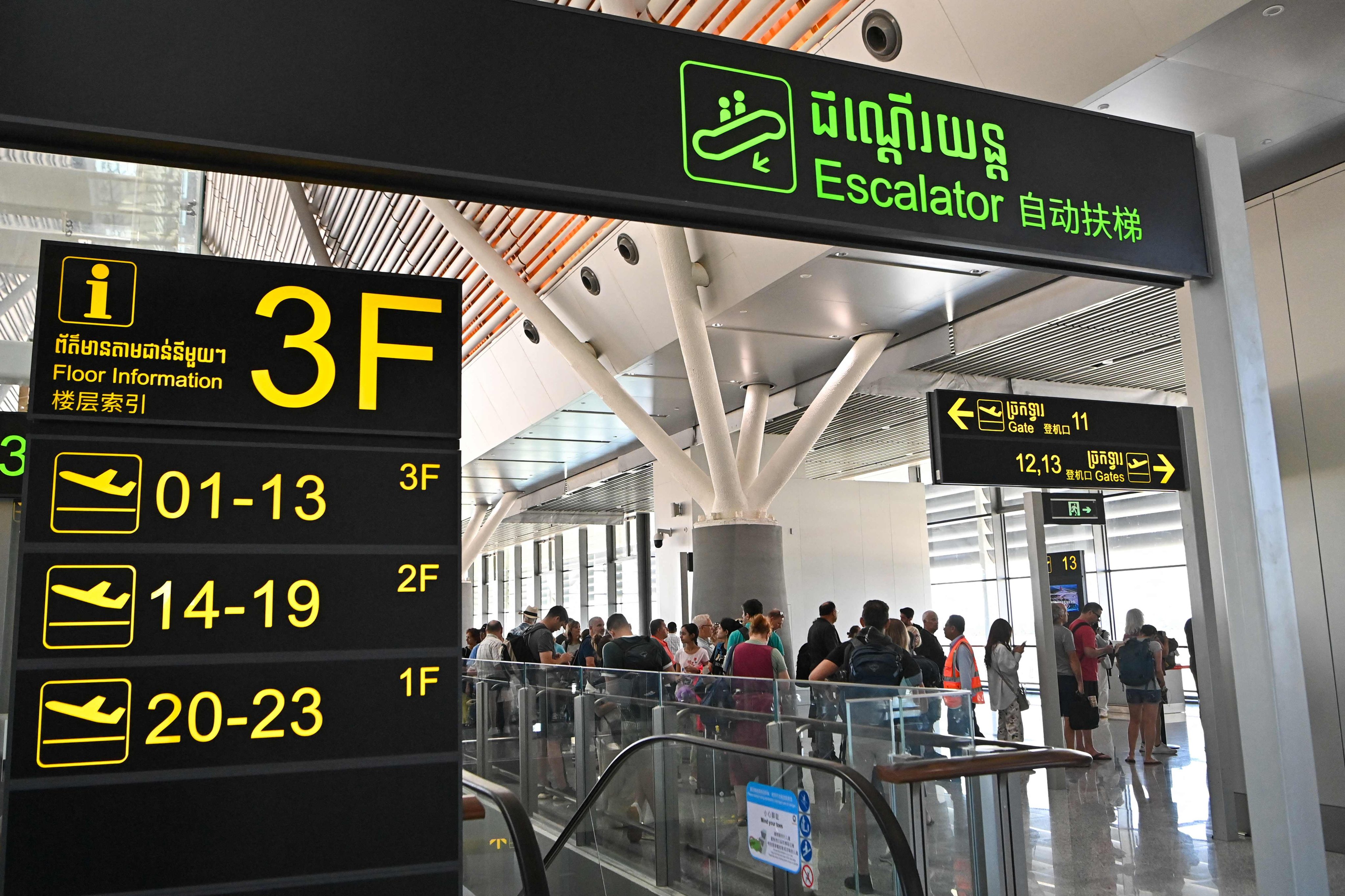 Tourists prepare to board a plane at the new Siem Reap-Angkor International Airport. Cambodia is eyeing direct flights to Melbourne,  as it seeks stronger ties with Australia through trade, education, and tourism. Photo: AFP