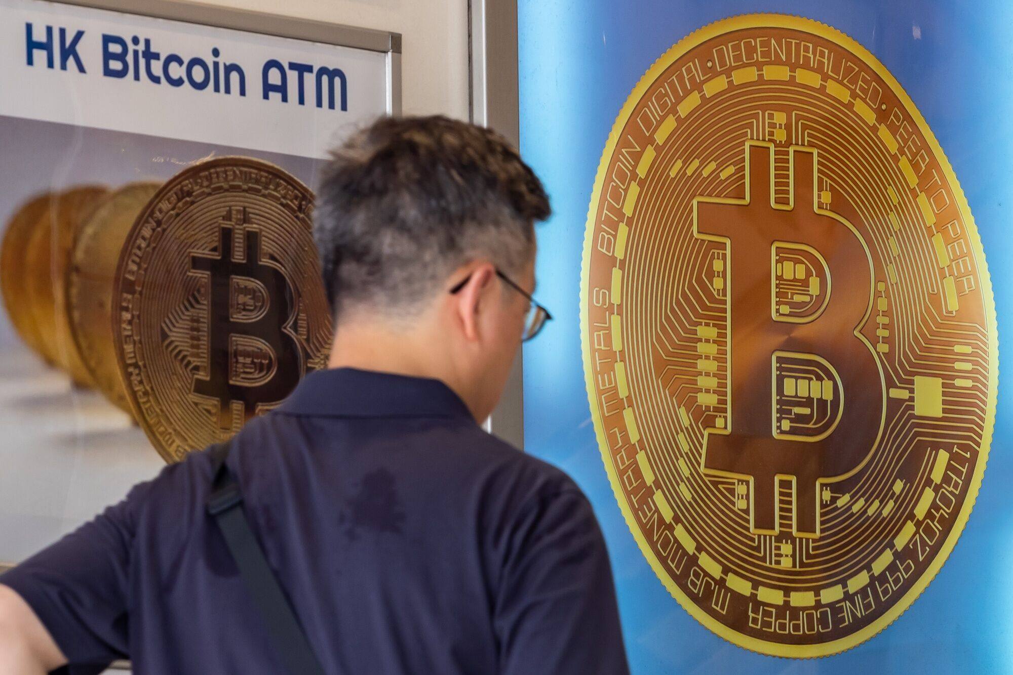 Signage for Bitcoin cryptocurrency in Hong Kong. Photo: Bloomberg