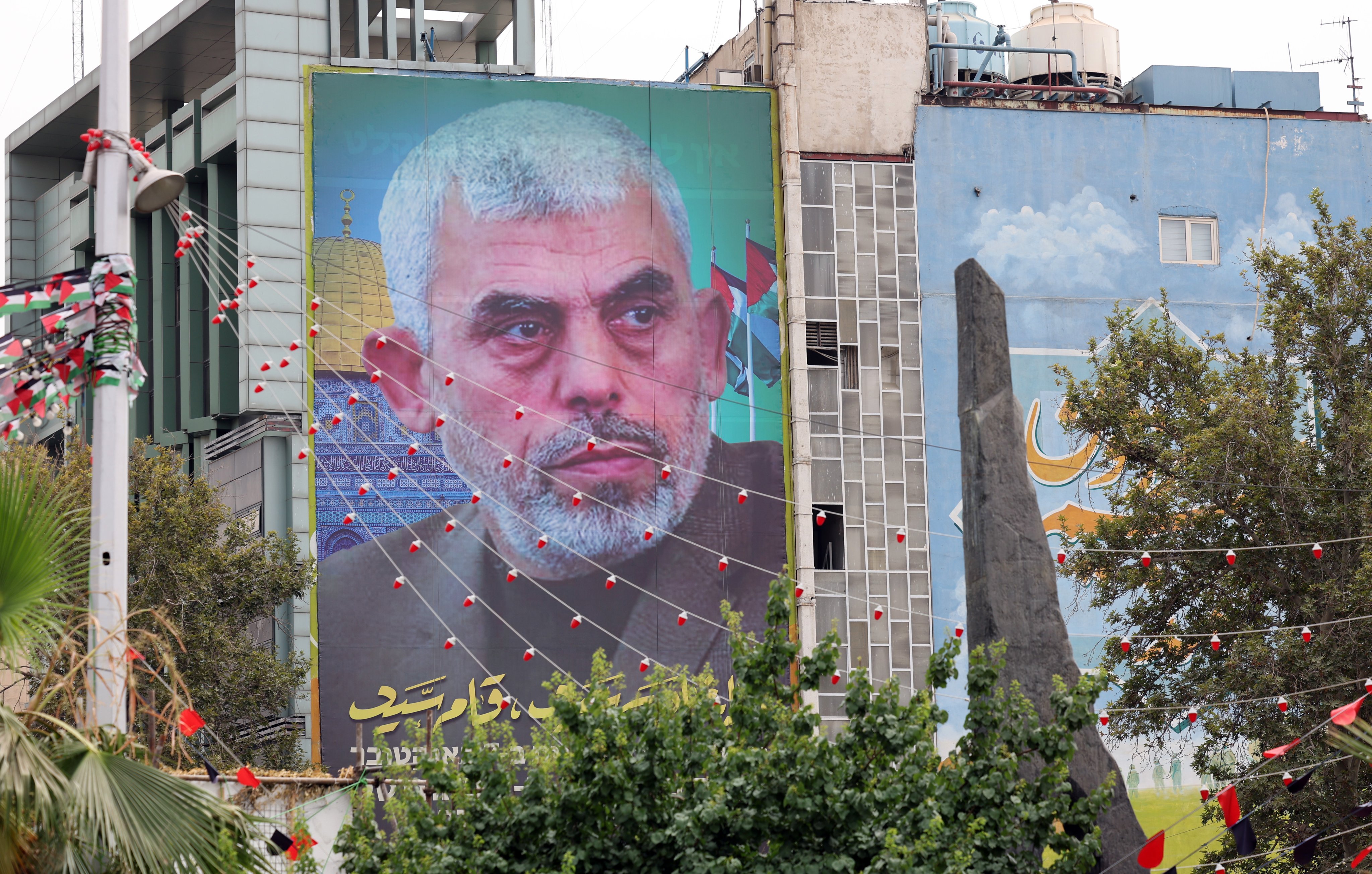 A large picture of Hamas leader Yahya Al-Sinwar hangs on a wall at Palestine Square in Tehran, Iran, in August. Photo: EPA-EFE