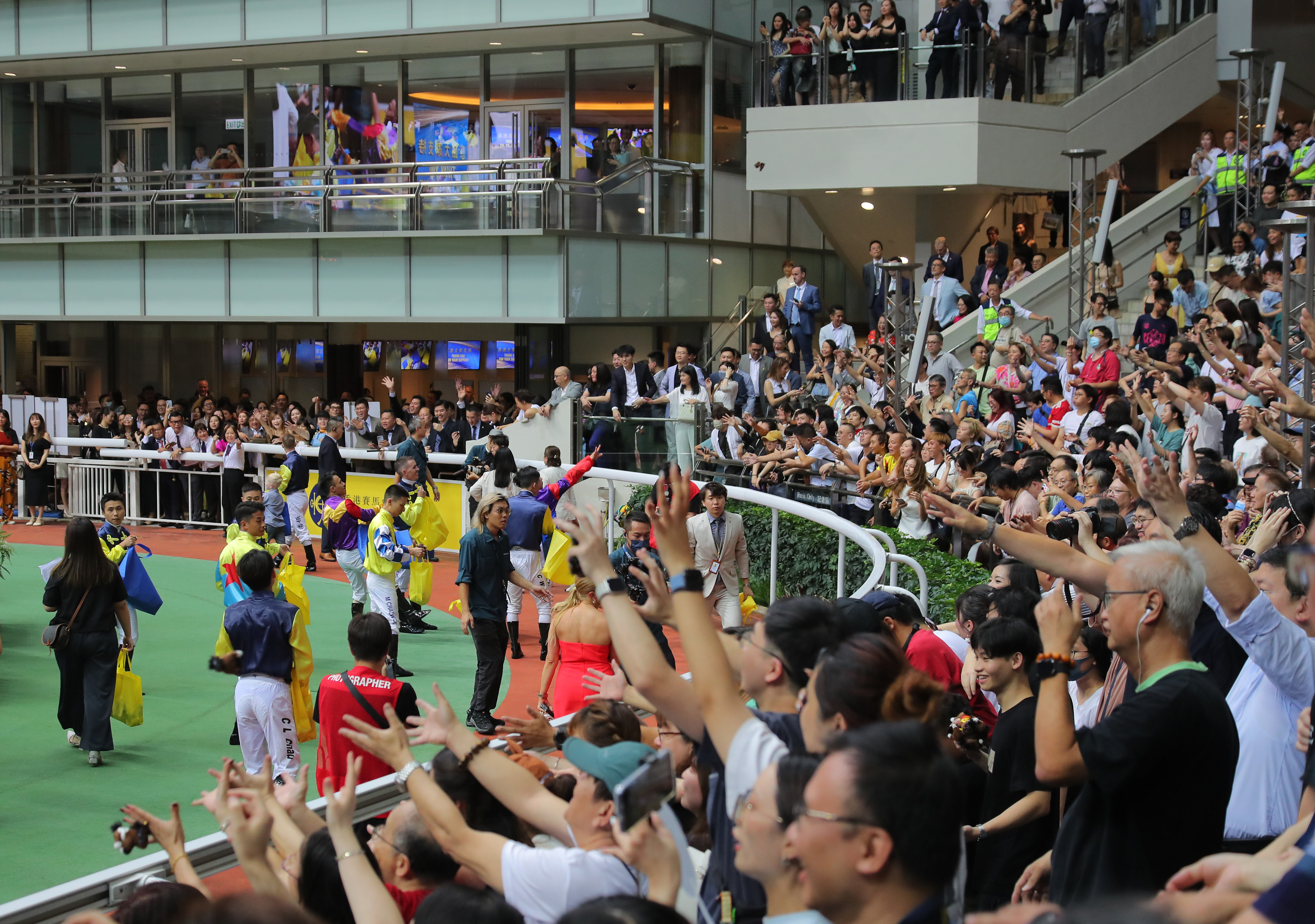 Jockeys gather before punters at the Sha Tin Racecourse. The Jockey Club said it faced significant external challenges during the financial year, including rising competition from Macau’s casinos. Photo: Kenneth Chan.