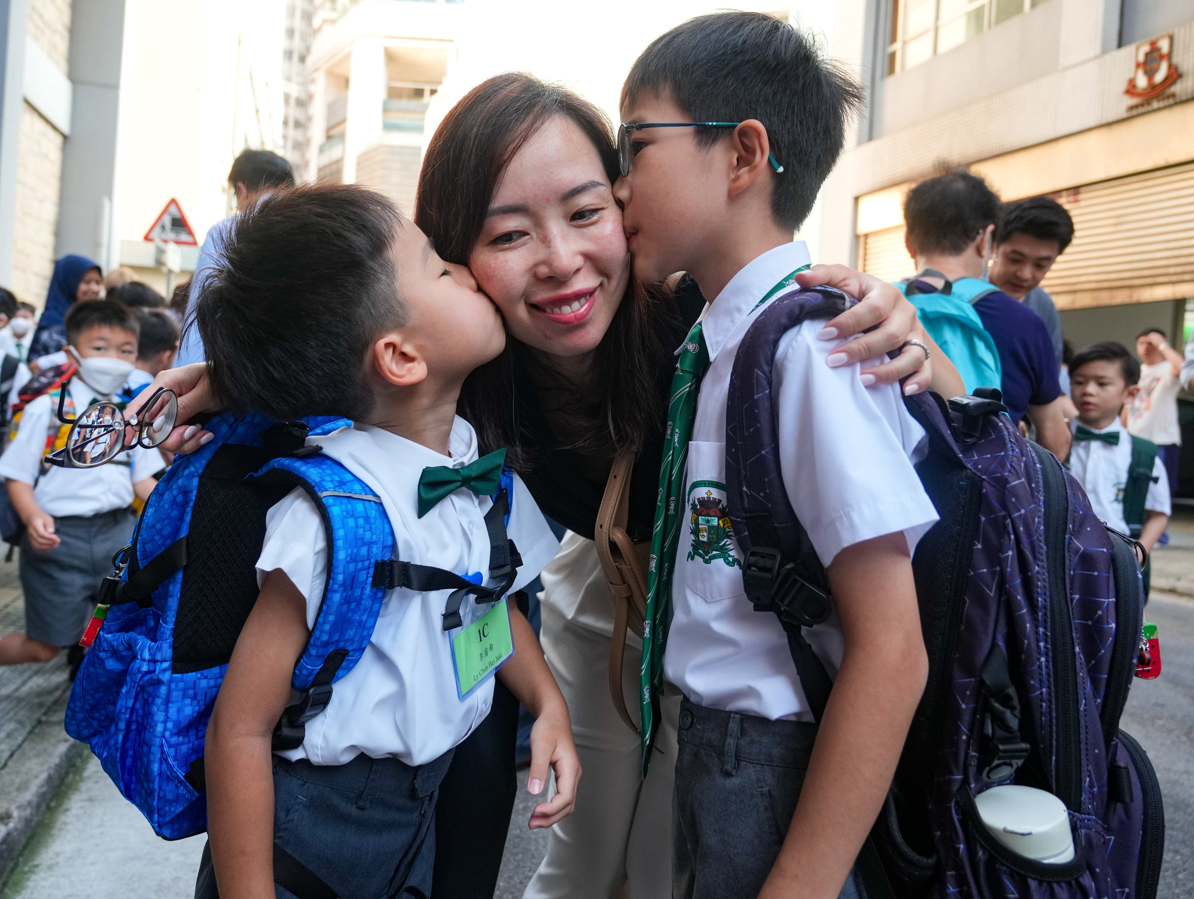 Students return to school on the first day of the academic year at St Joseph Primary School in Wan Chai. Photo: Sam Tsang