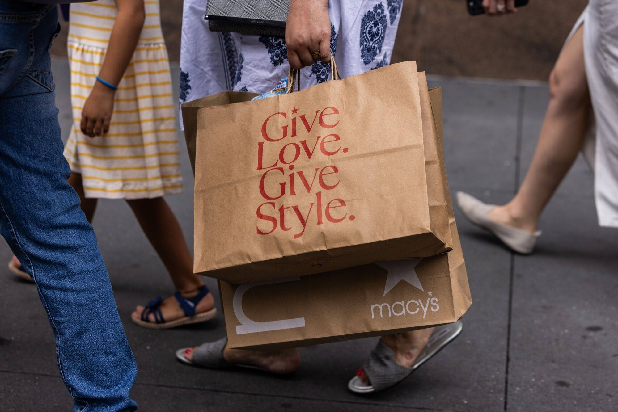 A shopper carries bags in the Herald Square neighbourhood of New York, US, on August 29. Photo: Bloomberg