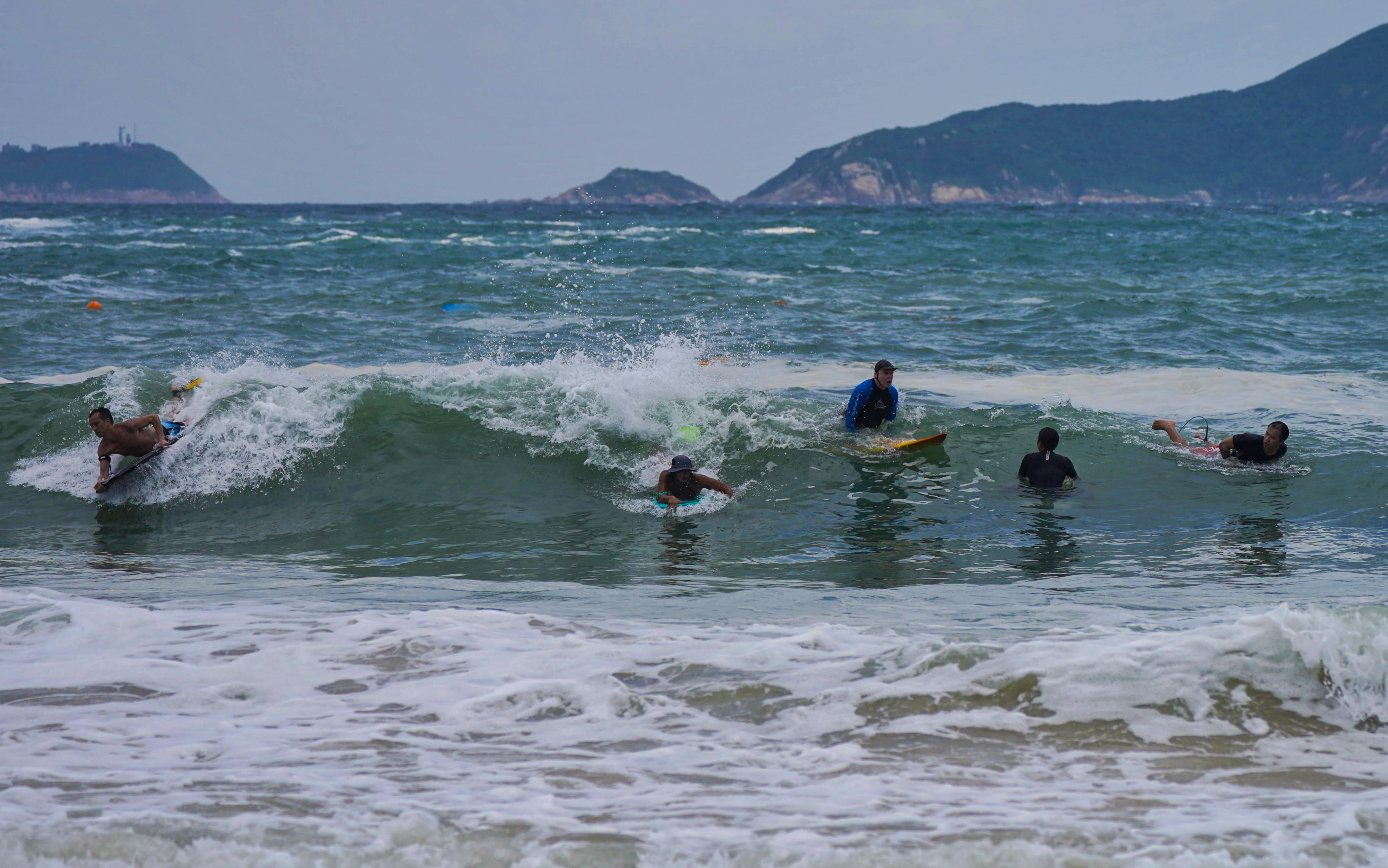 Surfers at Shek O Beach on Thursday. Photo: Elson Li