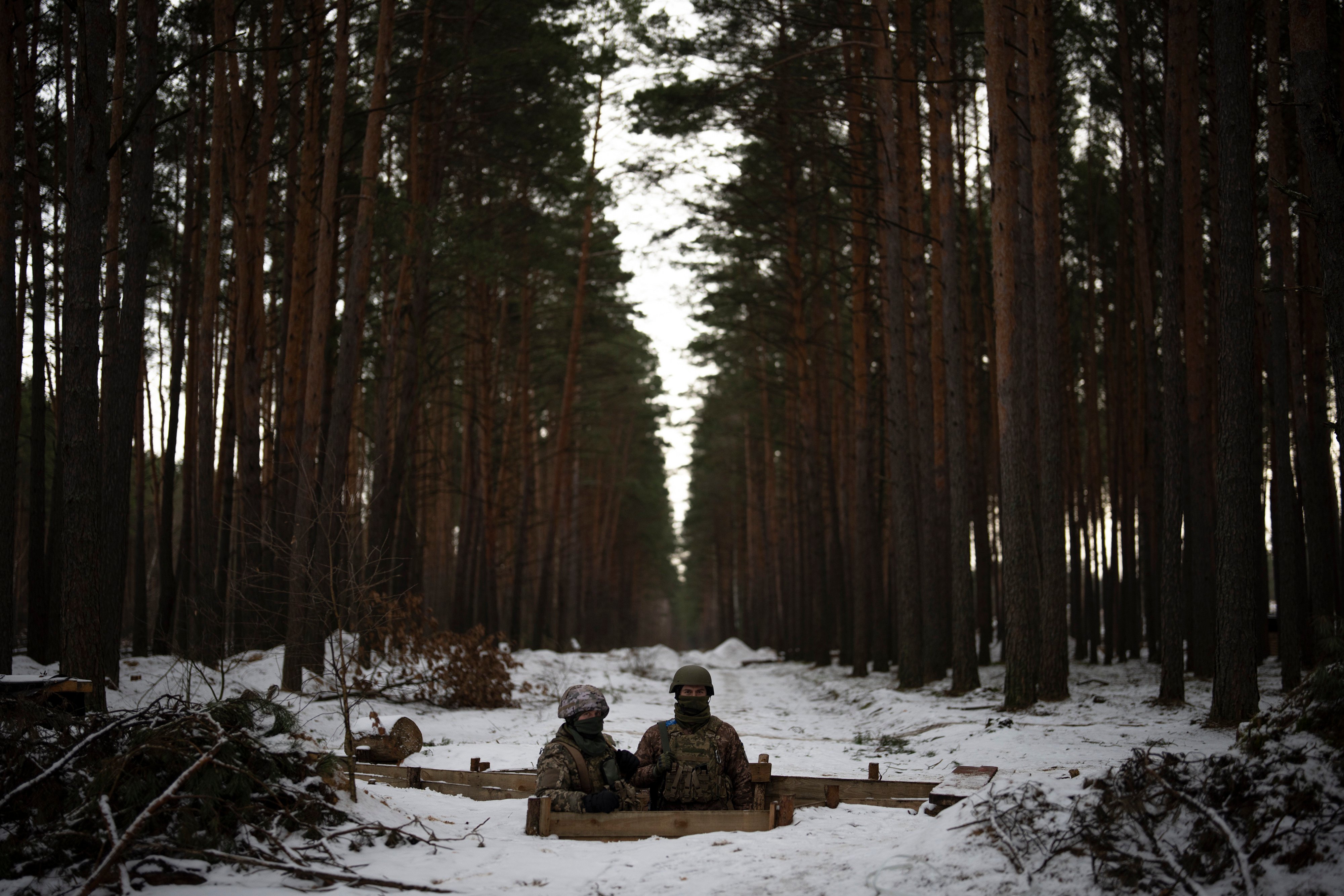 Ukrainian servicemen stand at a position close to the border with Belarus. Photo: AP