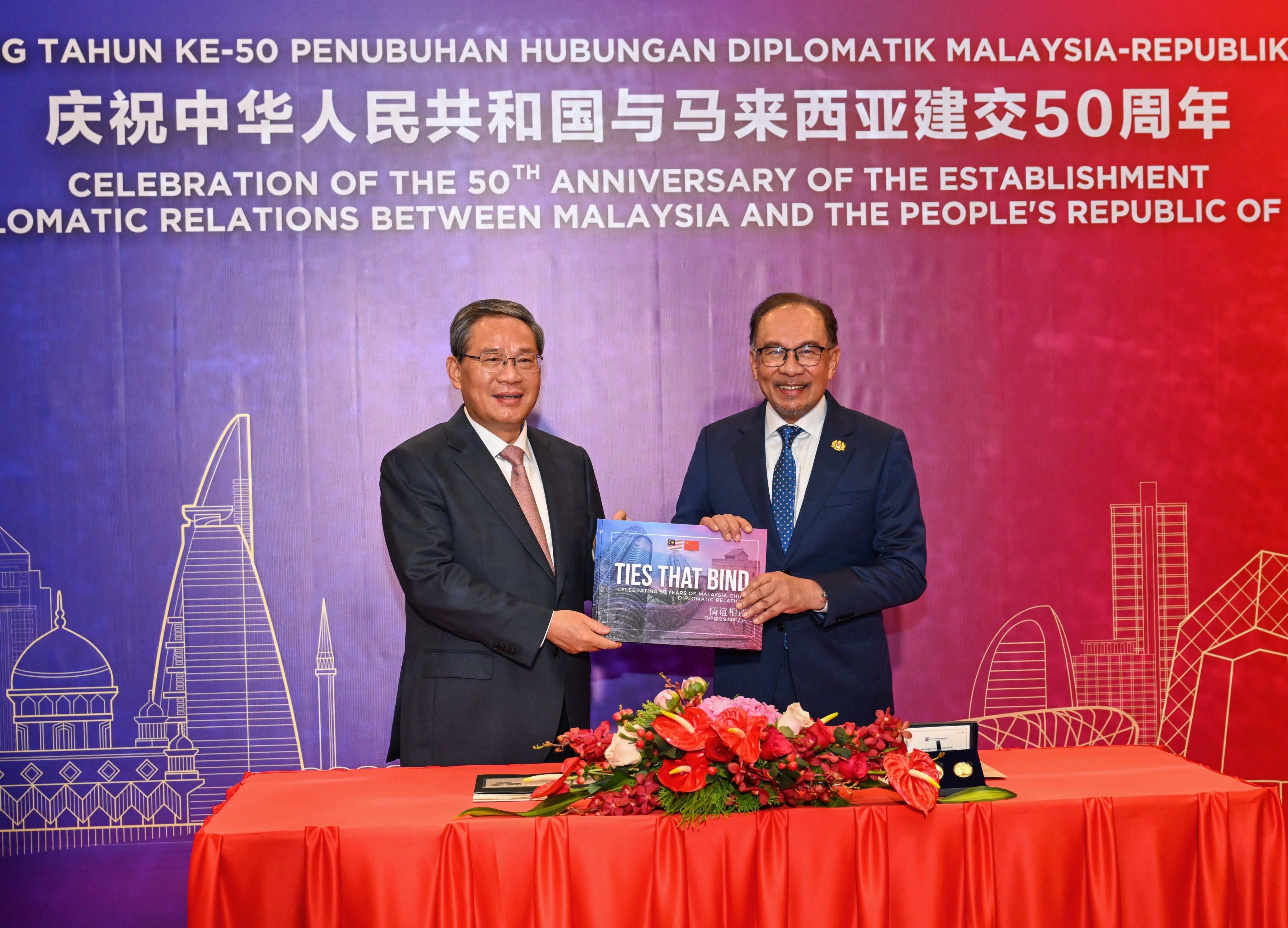 Chinese Premier Li Qiang and Malaysian Prime Minister Anwar Ibrahim celebrate the 50th anniversary of diplomatic relations between the two countries in Kuala Lumpur in June. Photo: Xinhua