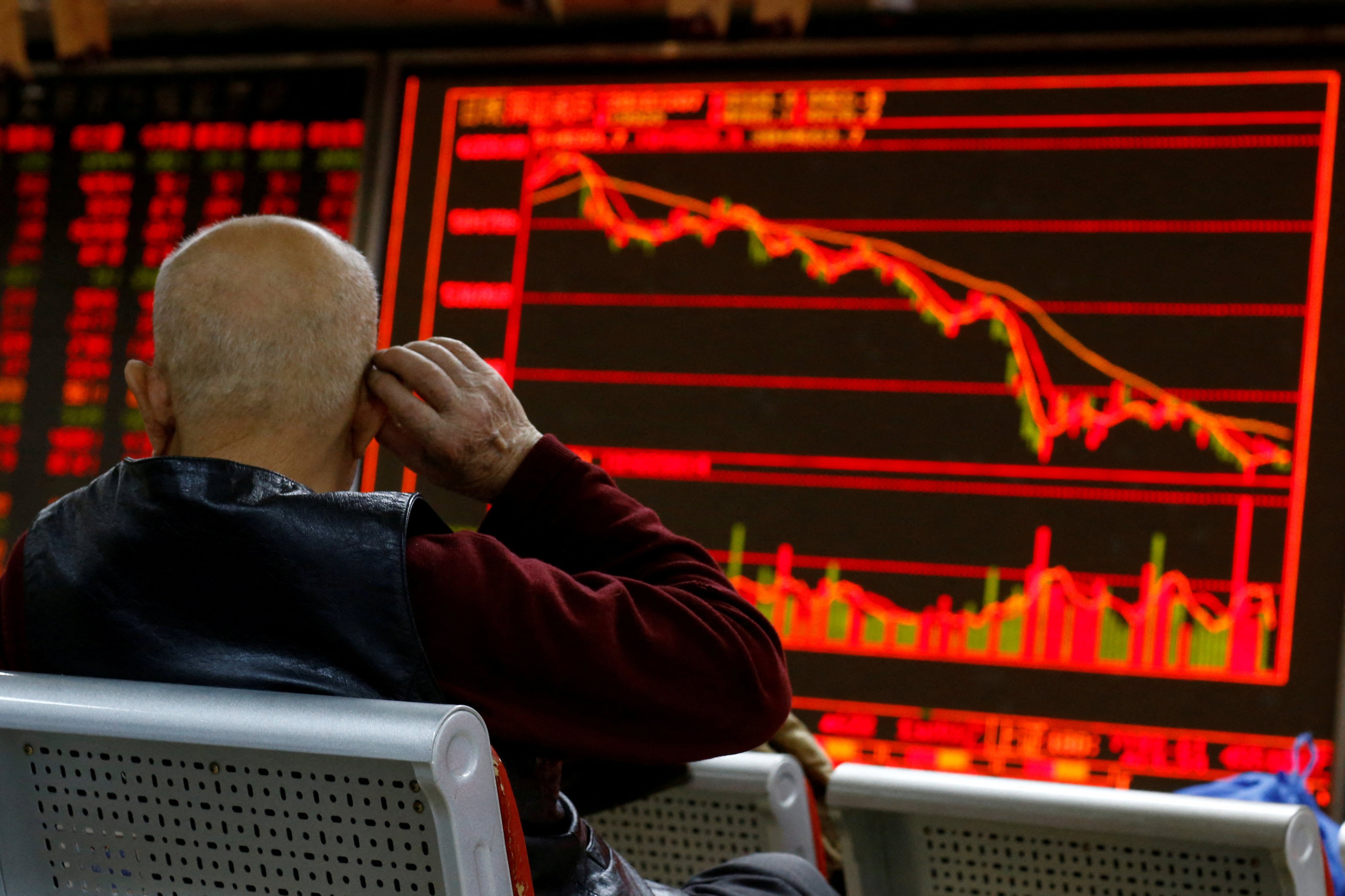 An investor at a brokerage in Beijing. Photo: Reuters 