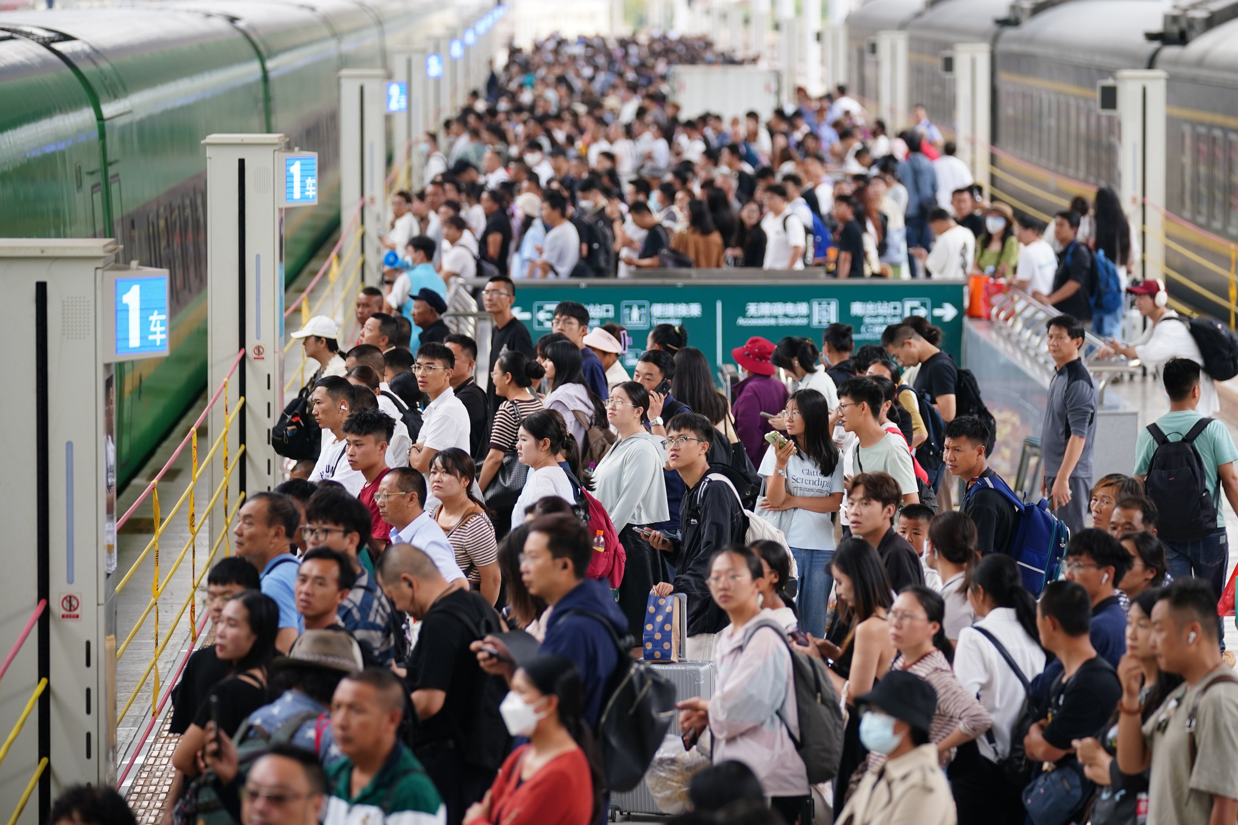 Passengers walk on the platform at Kunming Railway Station. Photo: VCG via Getty Images