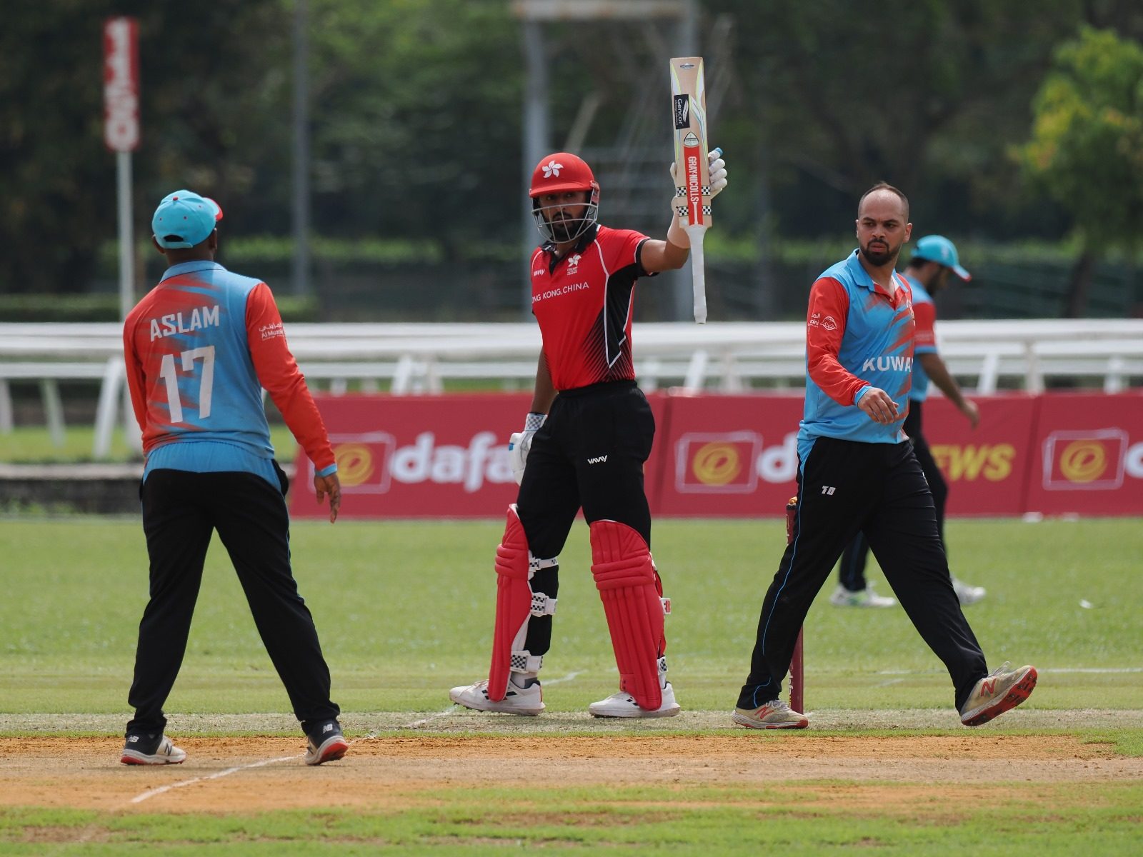 Hong Kong’s captain Nizakat Khan raises his bat after a half-century against Kuwait. Photo: Cricket Hong Kong, China