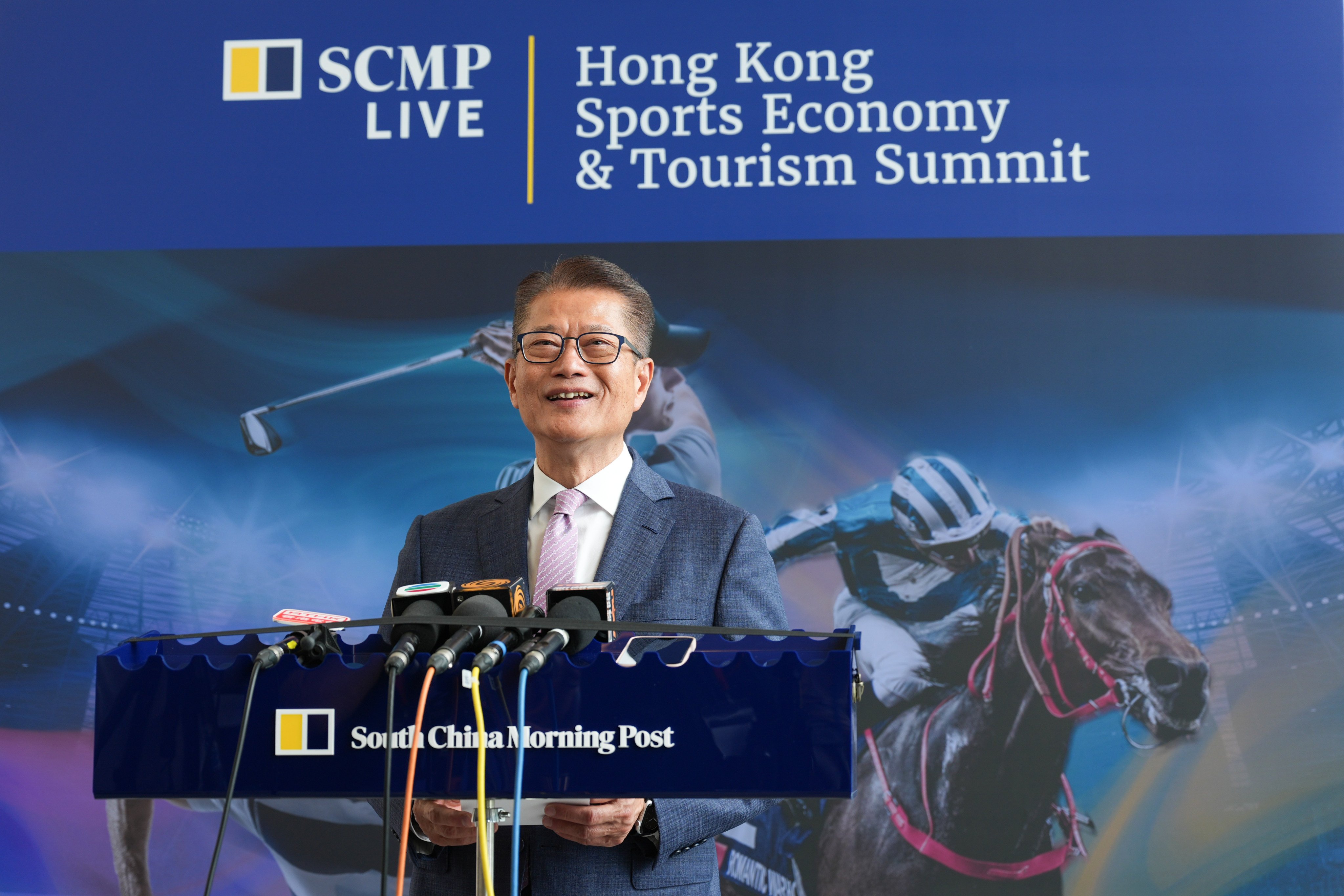 Financial Secretary Paul Chan speaks at the Hong Kong Sports Economy and Tourism Summit on Friday. Photo: Eugene Lee